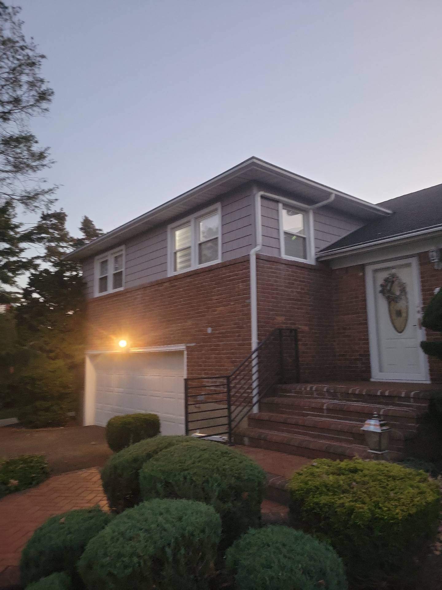 New Siding & Trim by Island Roofing Inc.