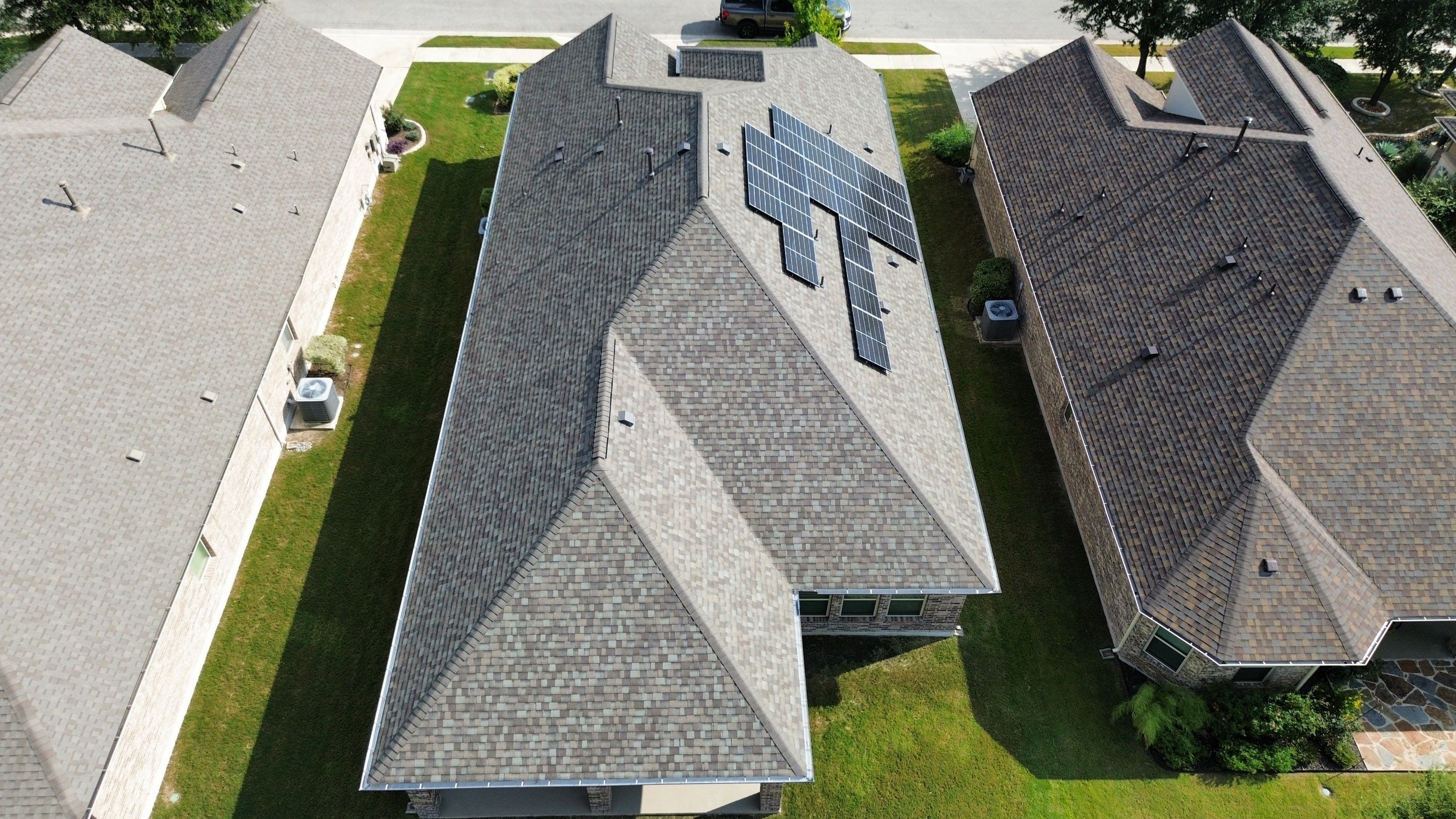 Full Roof Replacement with Solar Reinstall – Duration Driftwood | Round Rock, TX by Kstylez Roofing & Construction