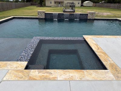 Modern Geometric Pool with Spa and Sheer Descent Water Wall