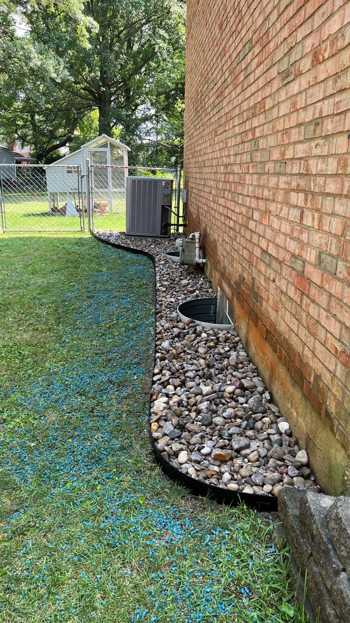French Drain Install with Oversized River Gravel and Steel Metal Edging by Reisenberg’s Lawn & Landscape, LLC