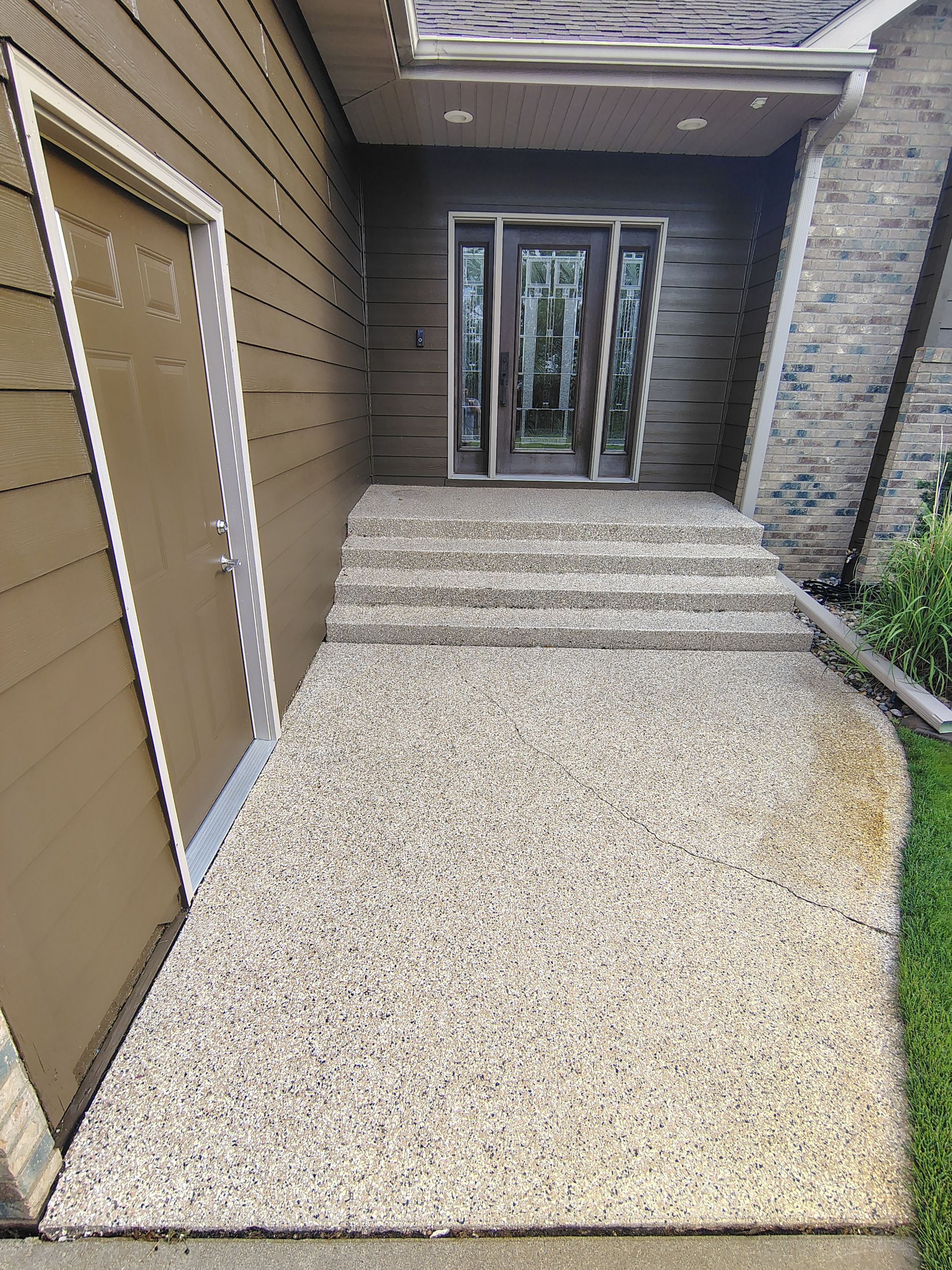 Textured Concrete Coating and Entryway Restoration in Madison by Select Painting, Coatings & Garage Cabinets