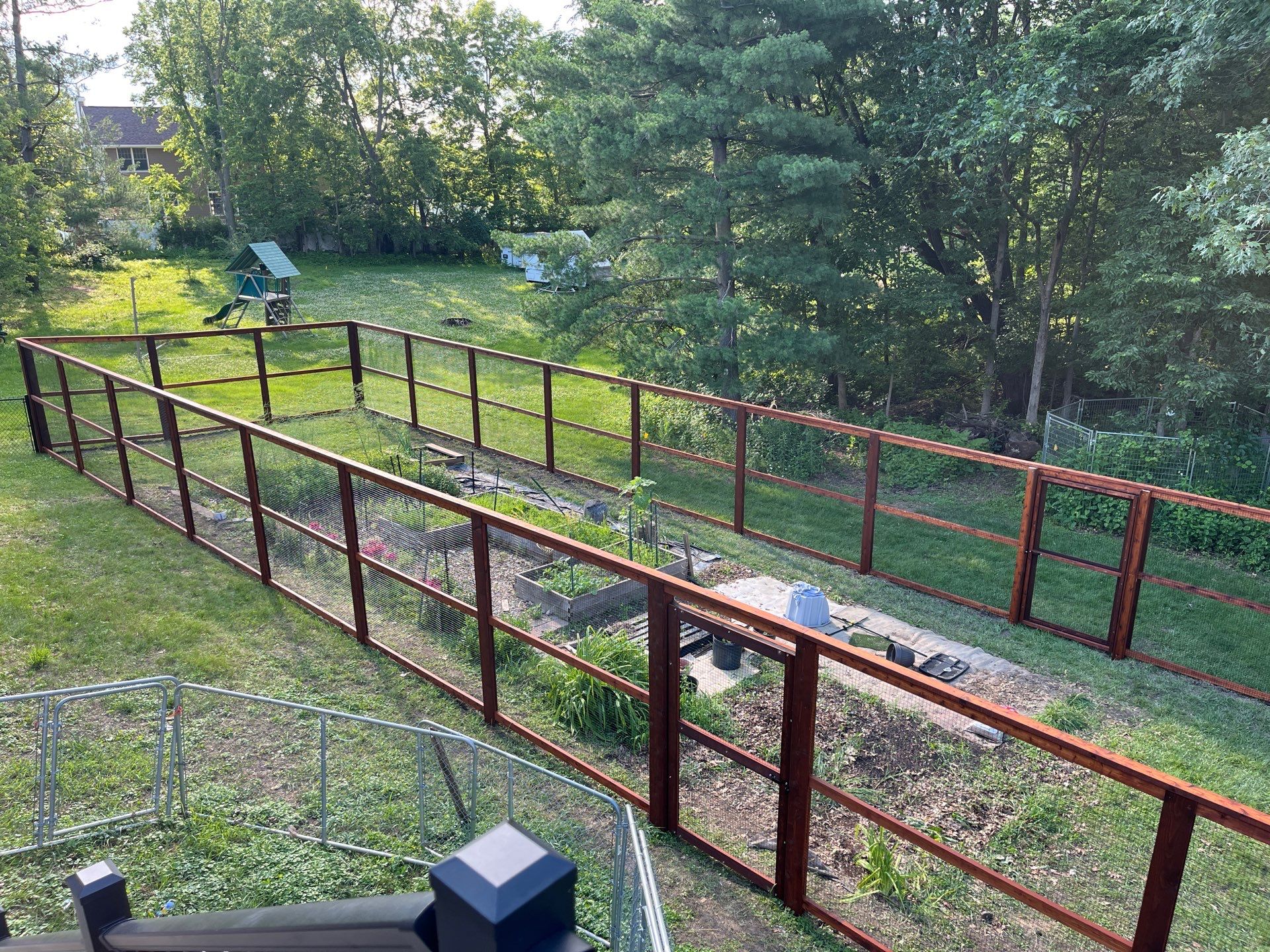 Stained Cedar Mahogany Garden Fence and Raised Bed Enclosure in Cedar Falls by Perfect Picket Fence and Stain