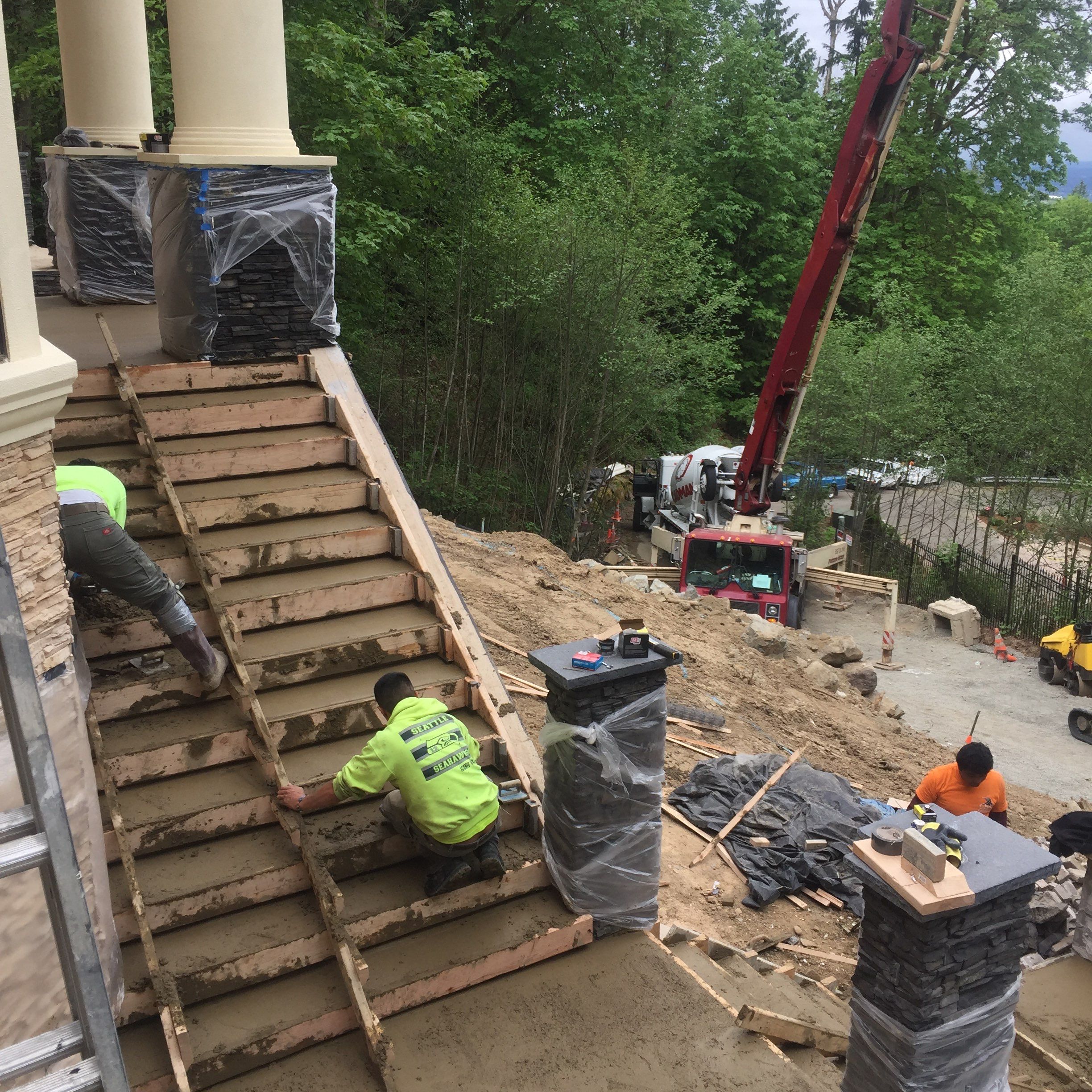 Asphalt Driveway and Stamped Concrete Patio Finish  by Jireh Asphalt & Concrete Inc 