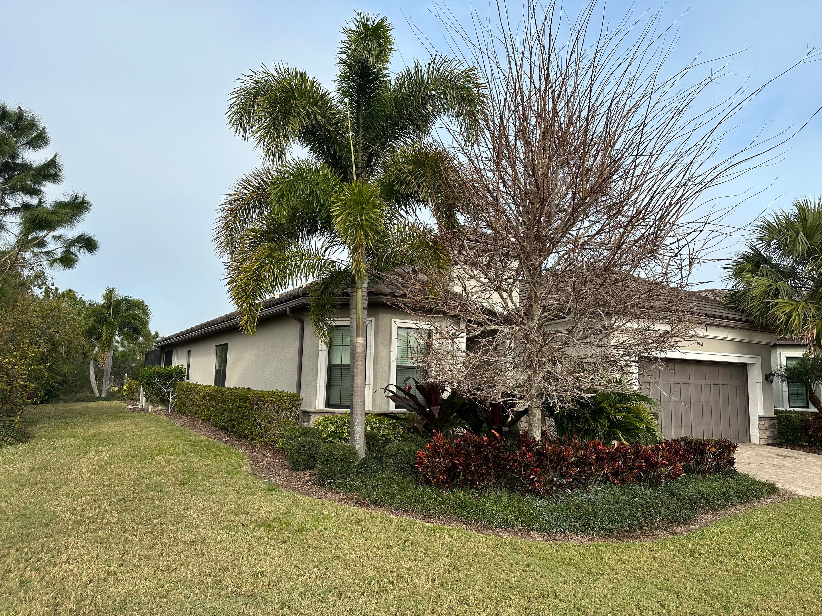 Concrete Tile Roof, Paver Pool Deck, Screen Enclosure & Driveway Cleaning in Artisan Lakes Esplanade, Palmetto, FL | Sunshine AquaWash by Sunshine AquaWash