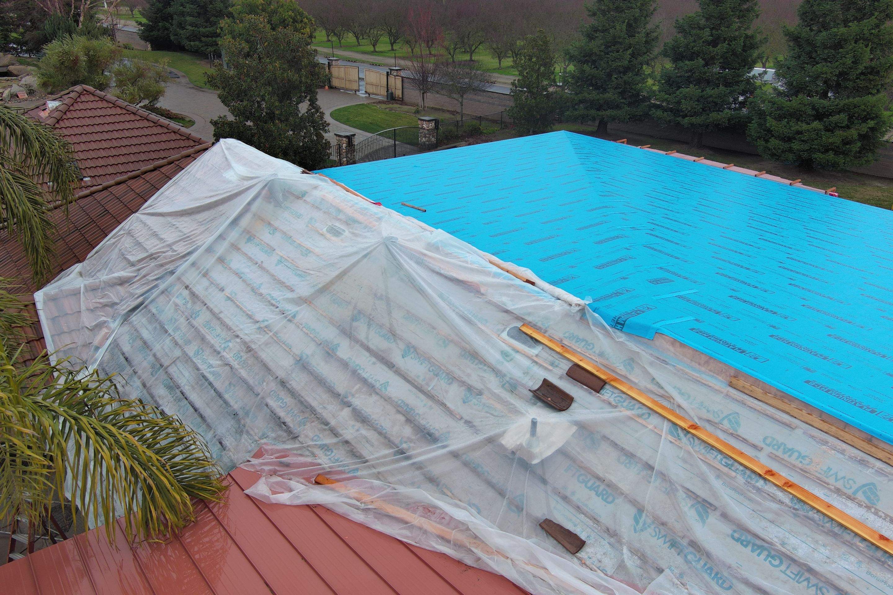 Tile, Metal, and TPO roofing project (new construction) by Straight Edge Roofing Inc