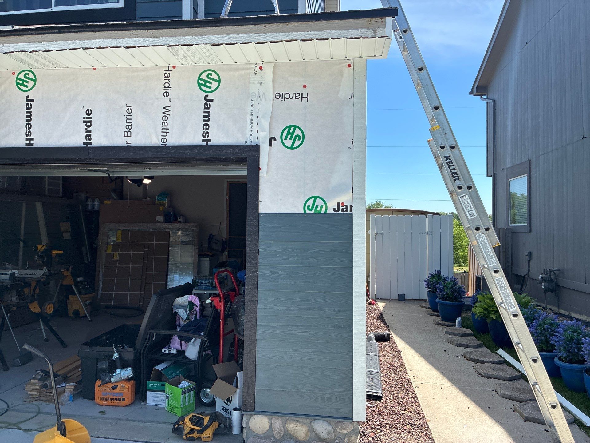 James Hardie Siding and Window Replacement with Arctic White Trim by Carps Complete Exteriors