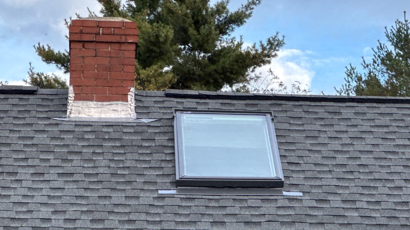 Complete Roof Replacement with GAF Pewter Gray HDZ™ Shingles, VELUX Skylights & New Gutters by Sensible Home Solutions
