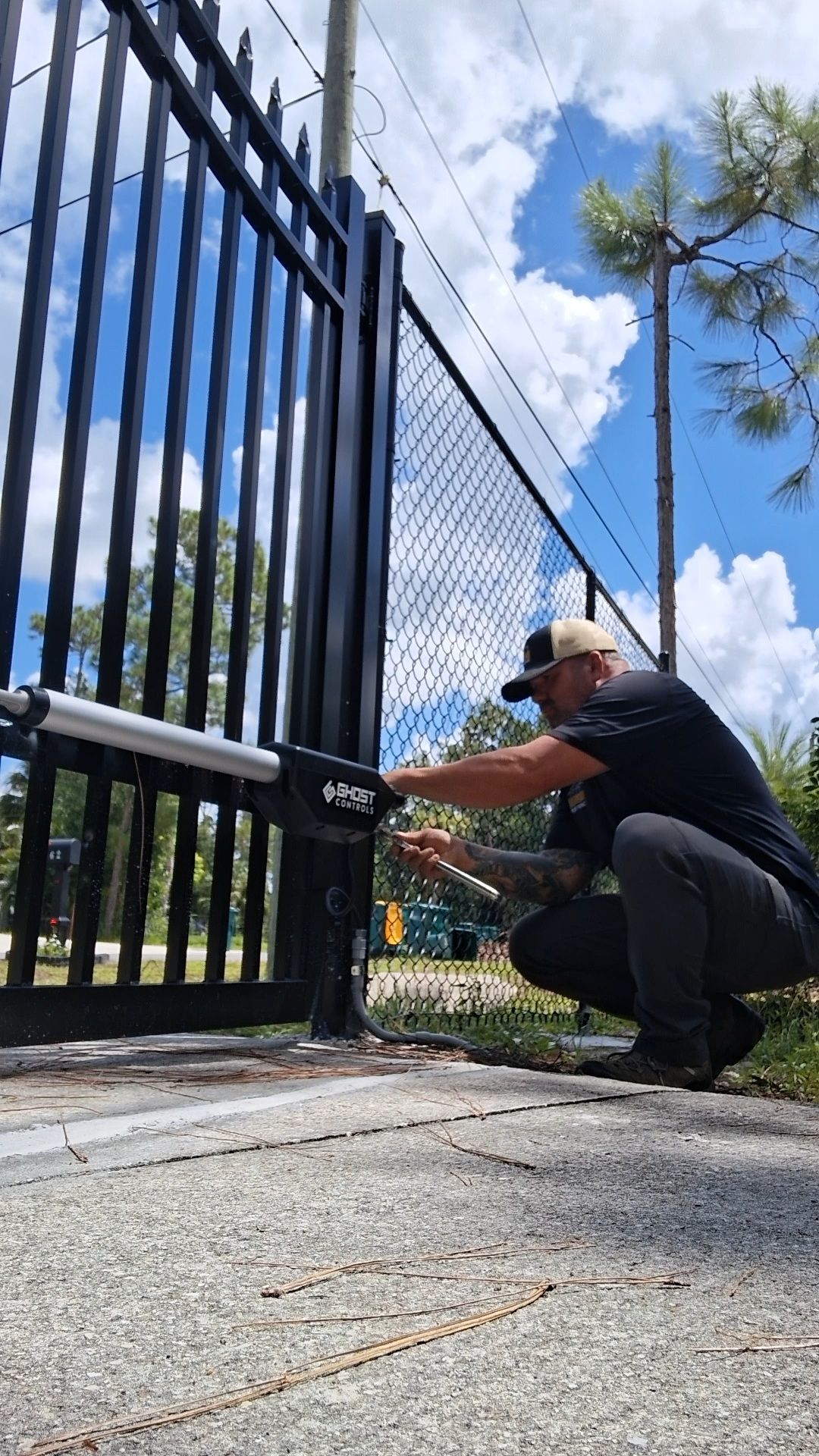 Automated Driveway Gate and Black Chain Link Fence Installation by True Fence LLC