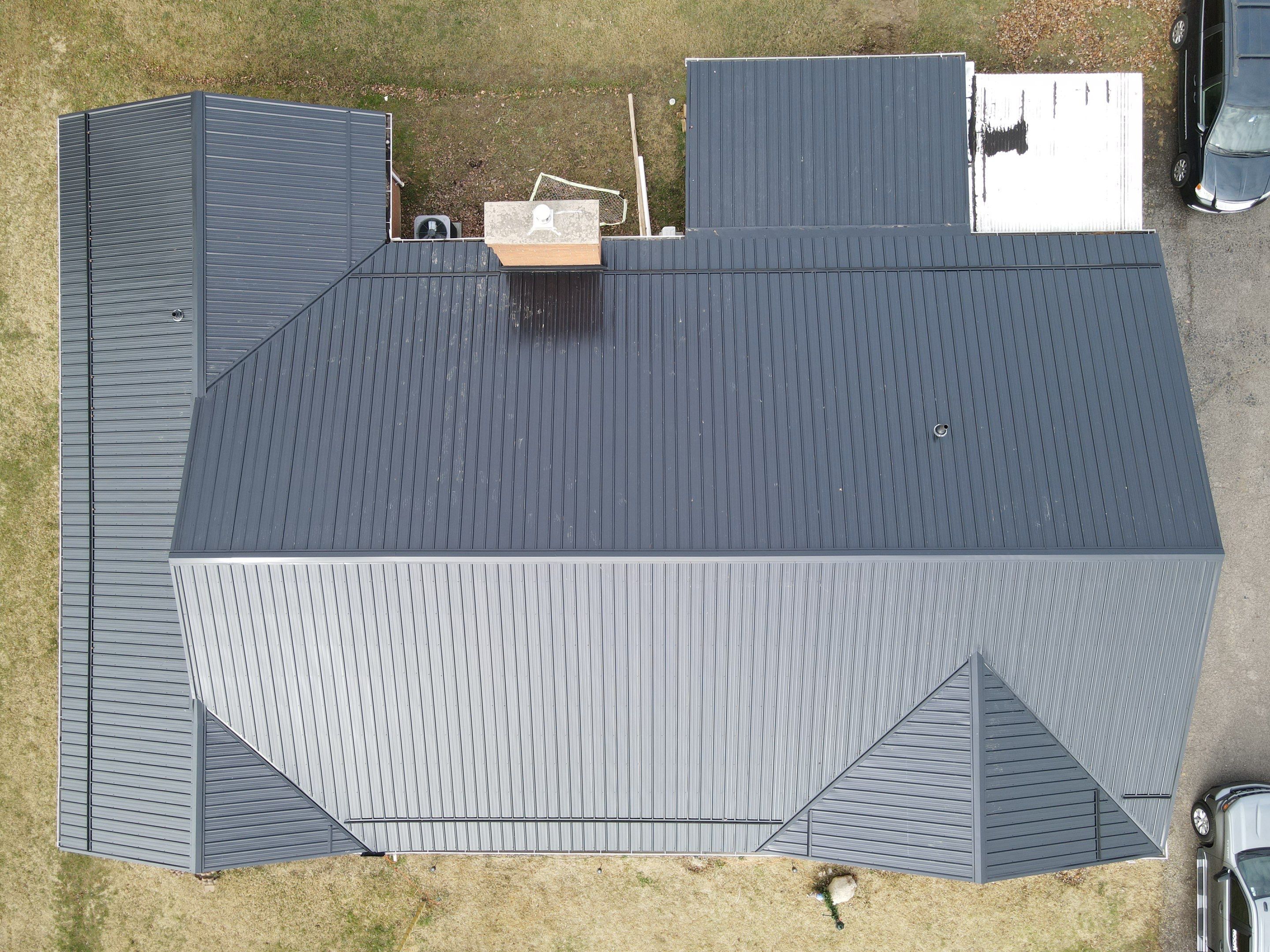 Residential Roofing Installation using Perfromance Panel Metal - Black by RoofX 