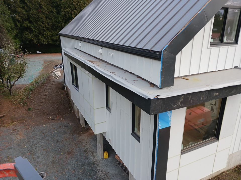 Residential Roofing Installation using multiple products by Top Notch Roofing Inc