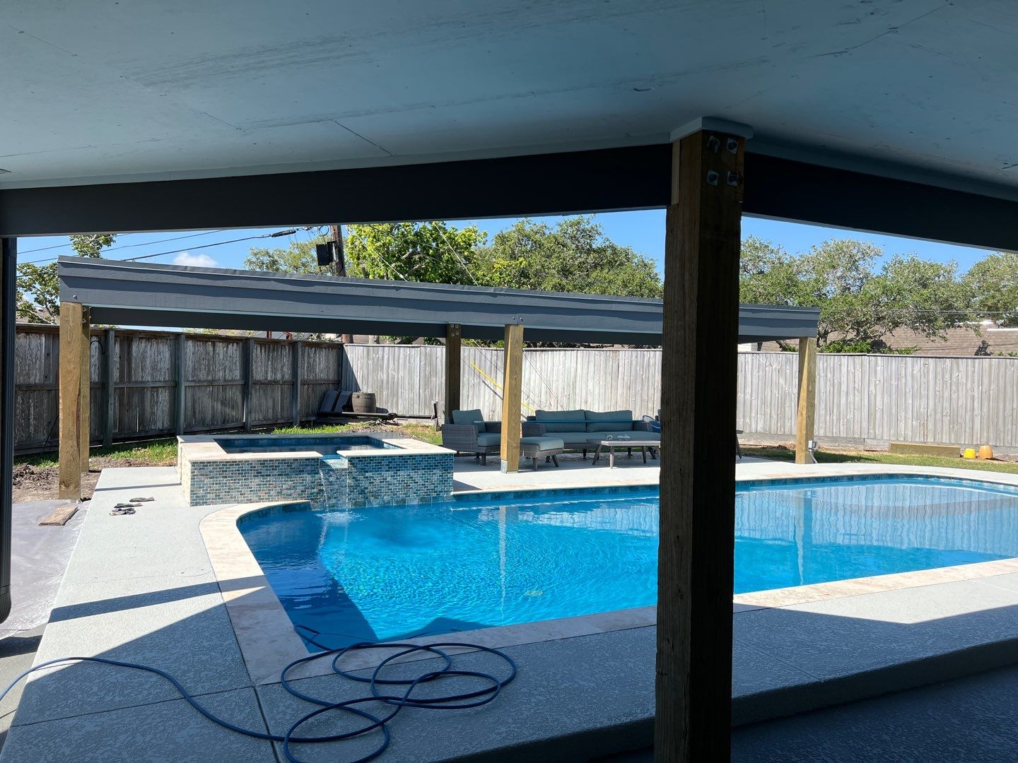 Beautiful pool side build by Bayfront Roofing and Construction