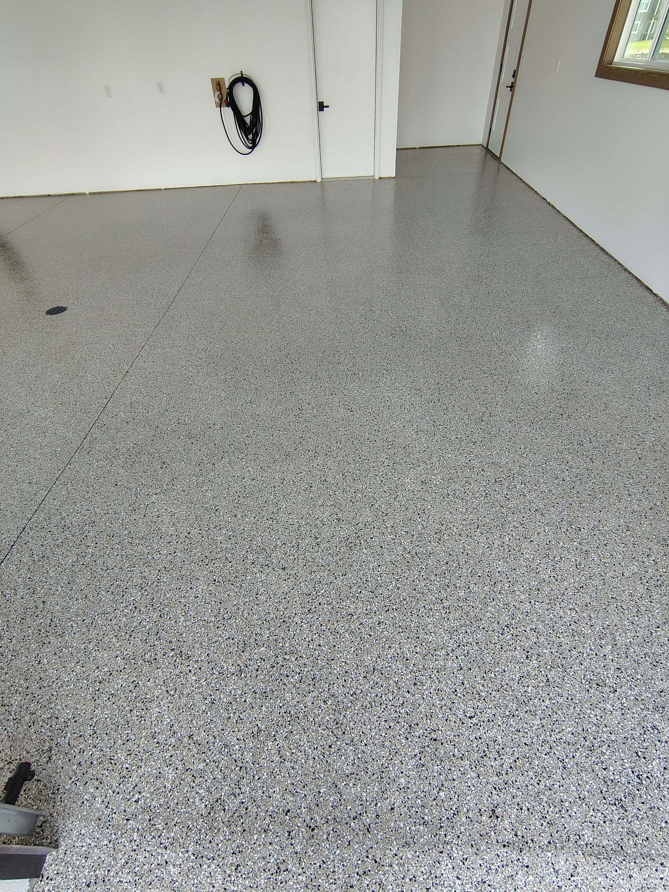 Gray and White Speckled Epoxy Garage Floor Coating in Tea by Select Painting, Coatings & Garage Cabinets