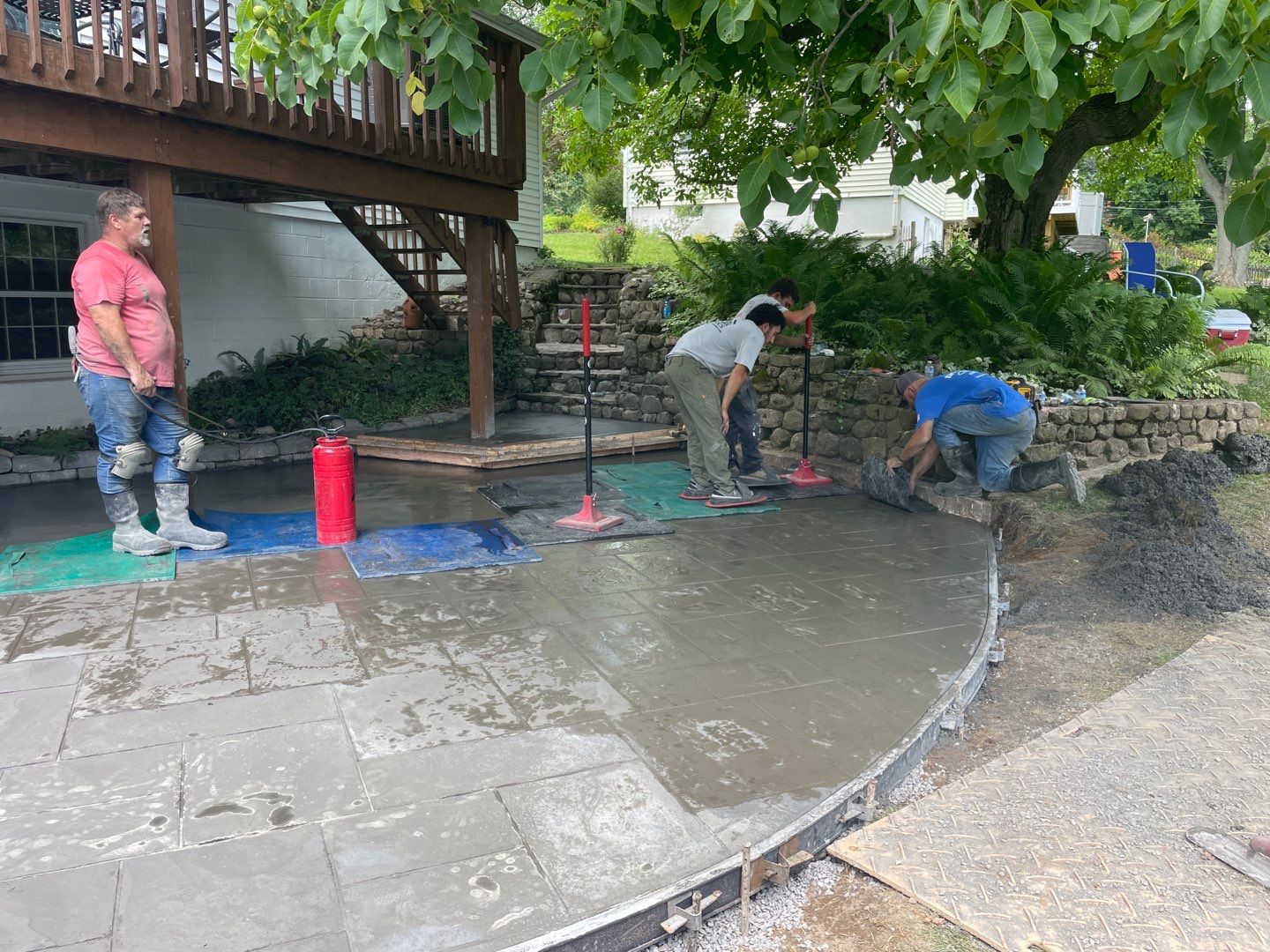 Majestic ashlar stamped concrete patio  by NG Masonry & Construction LLC