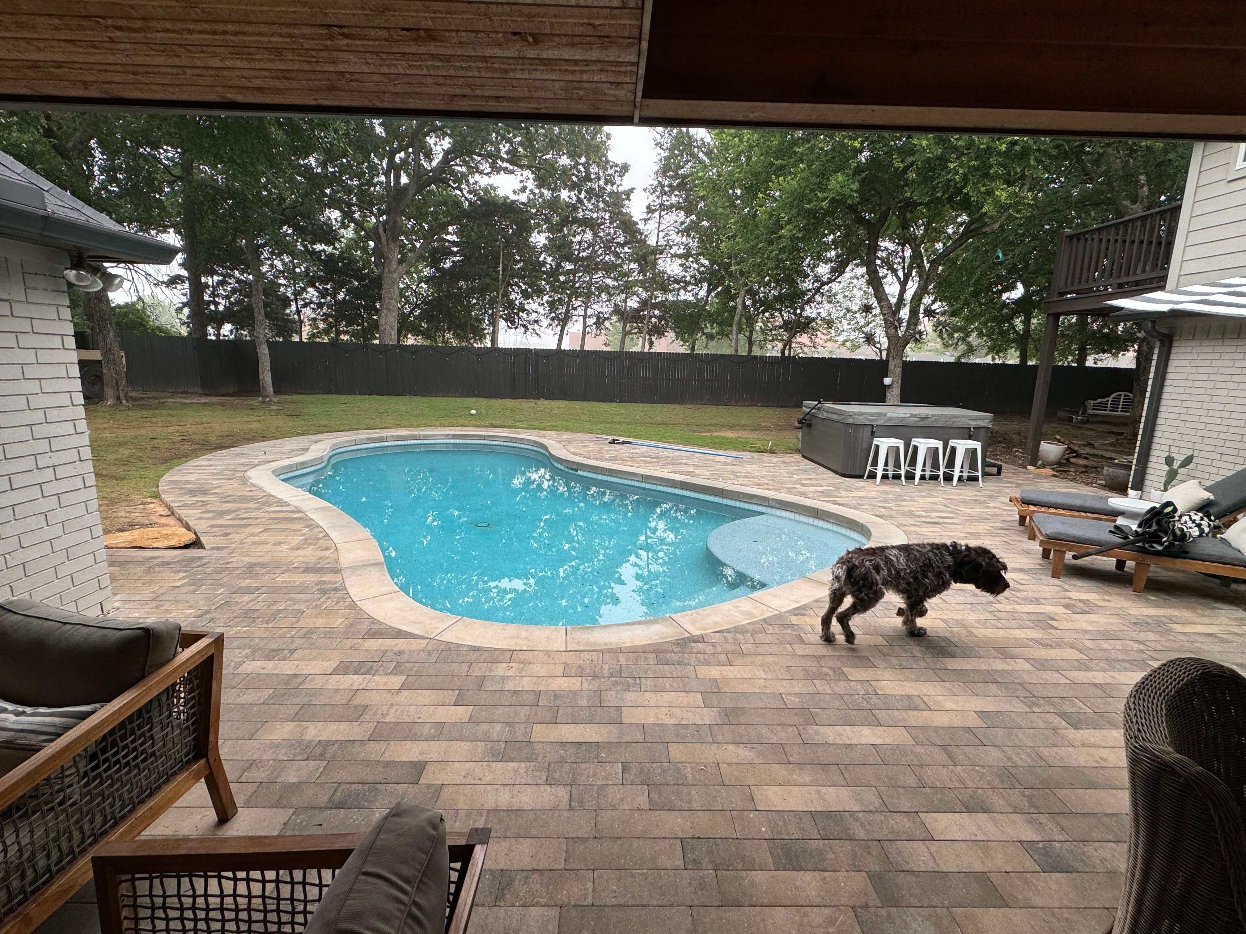 Freeform Pool with Raised Spa and Natural Stone Deck by Pinnacle Pools and Spas - DFW