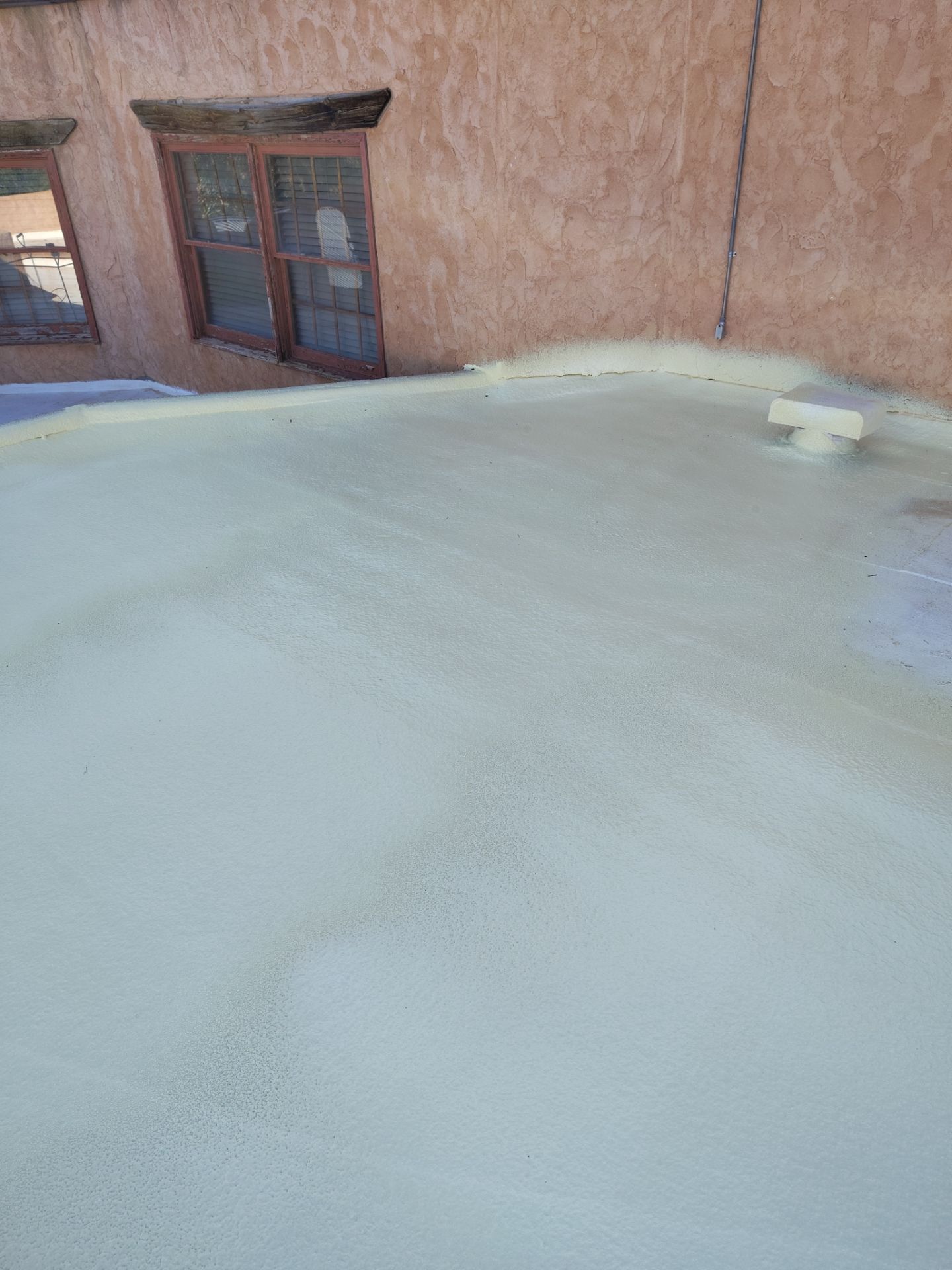 Residential roof application by SPF Services 
