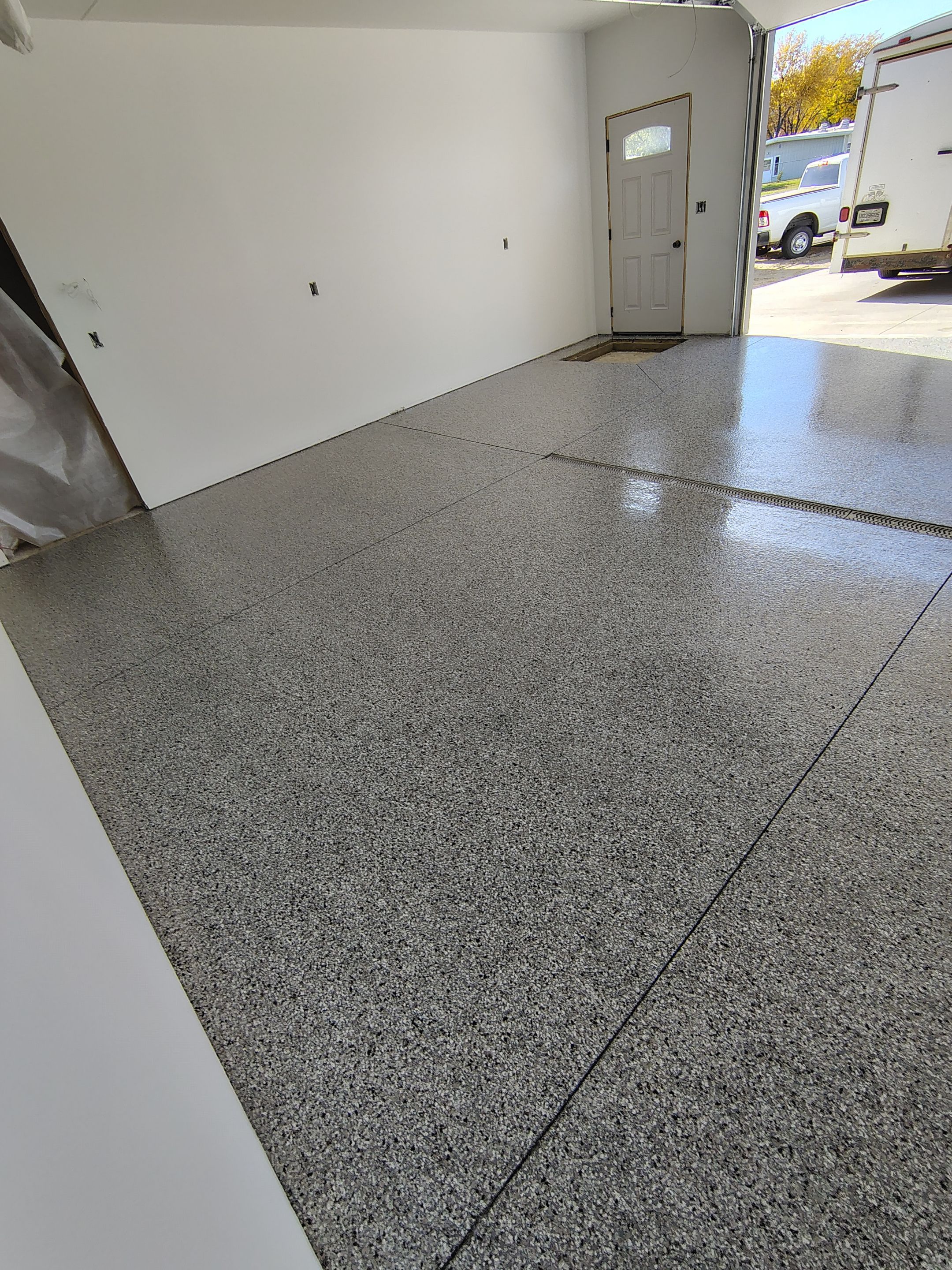 Custom Garage and Basement Epoxy Floor Coating in Menno by Select Painting, Coatings & Garage Cabinets