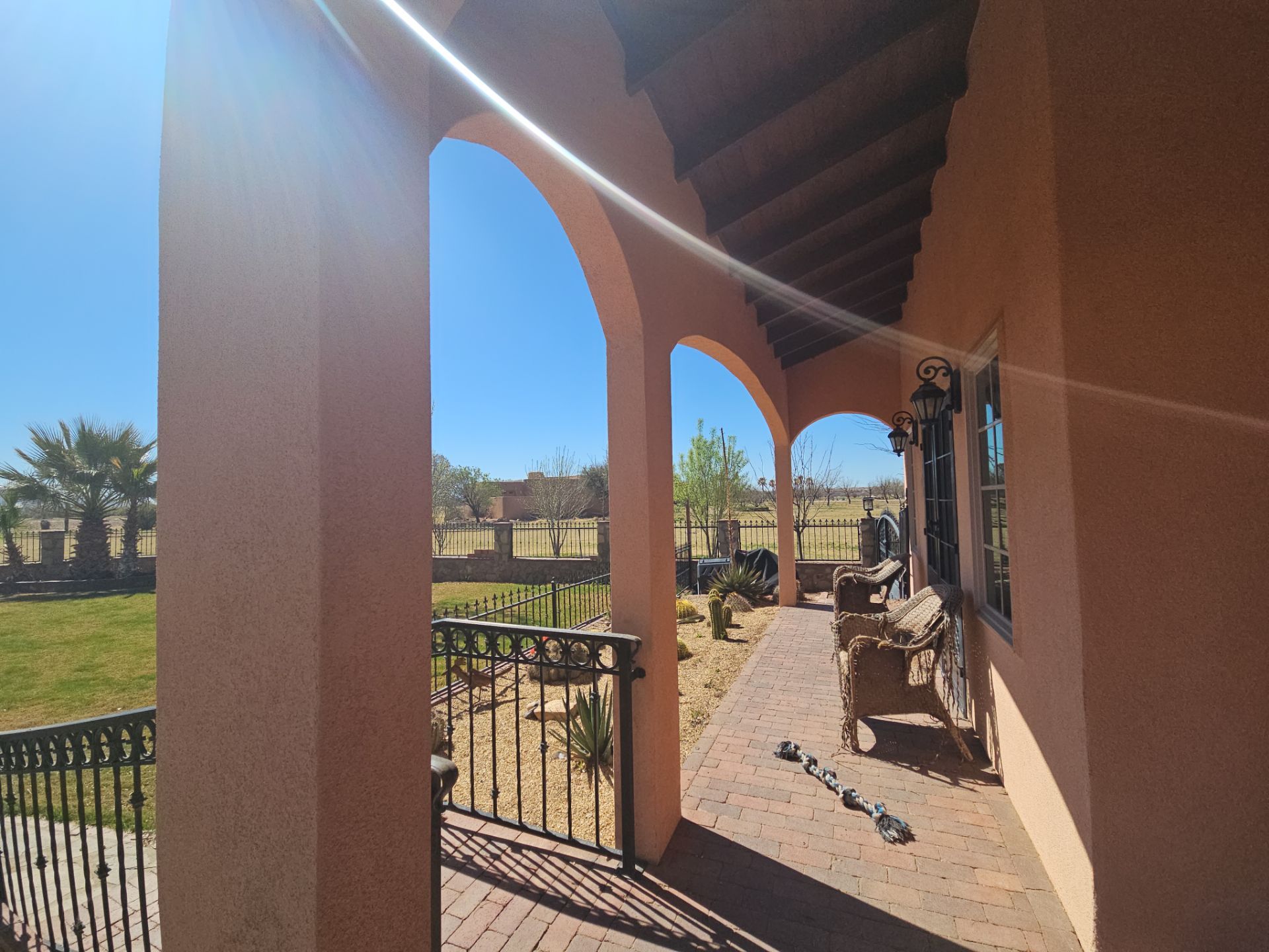 Exterior Painting with Stucco Damage by Regal Renovate