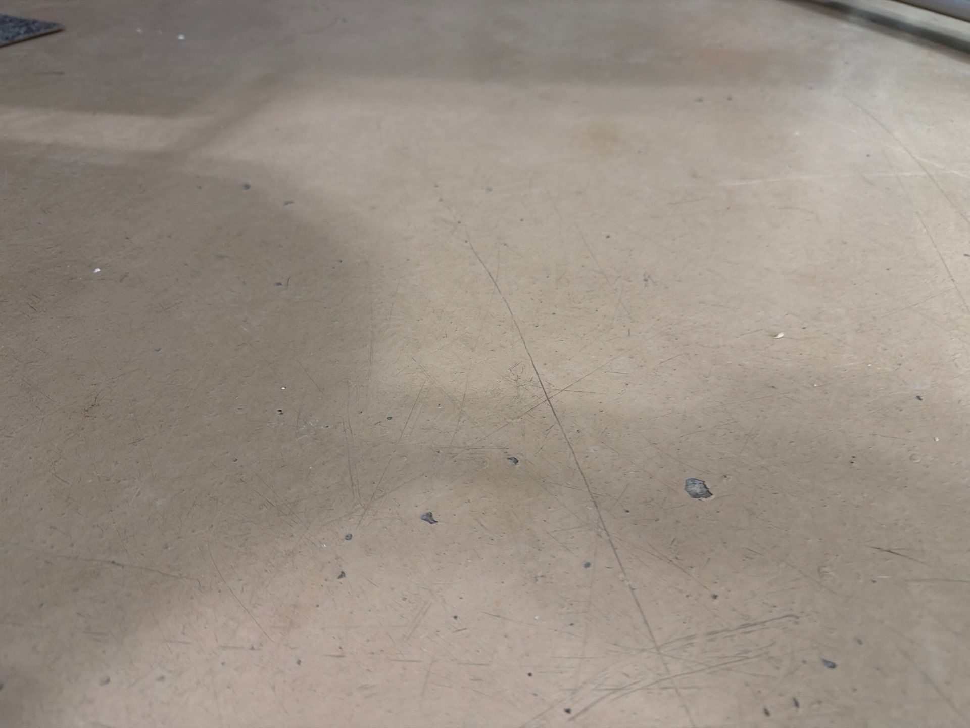 Residential Garage Floor Coating with Grey Speckled Epoxy Finish by Select Painting, Coatings & Garage Cabinets