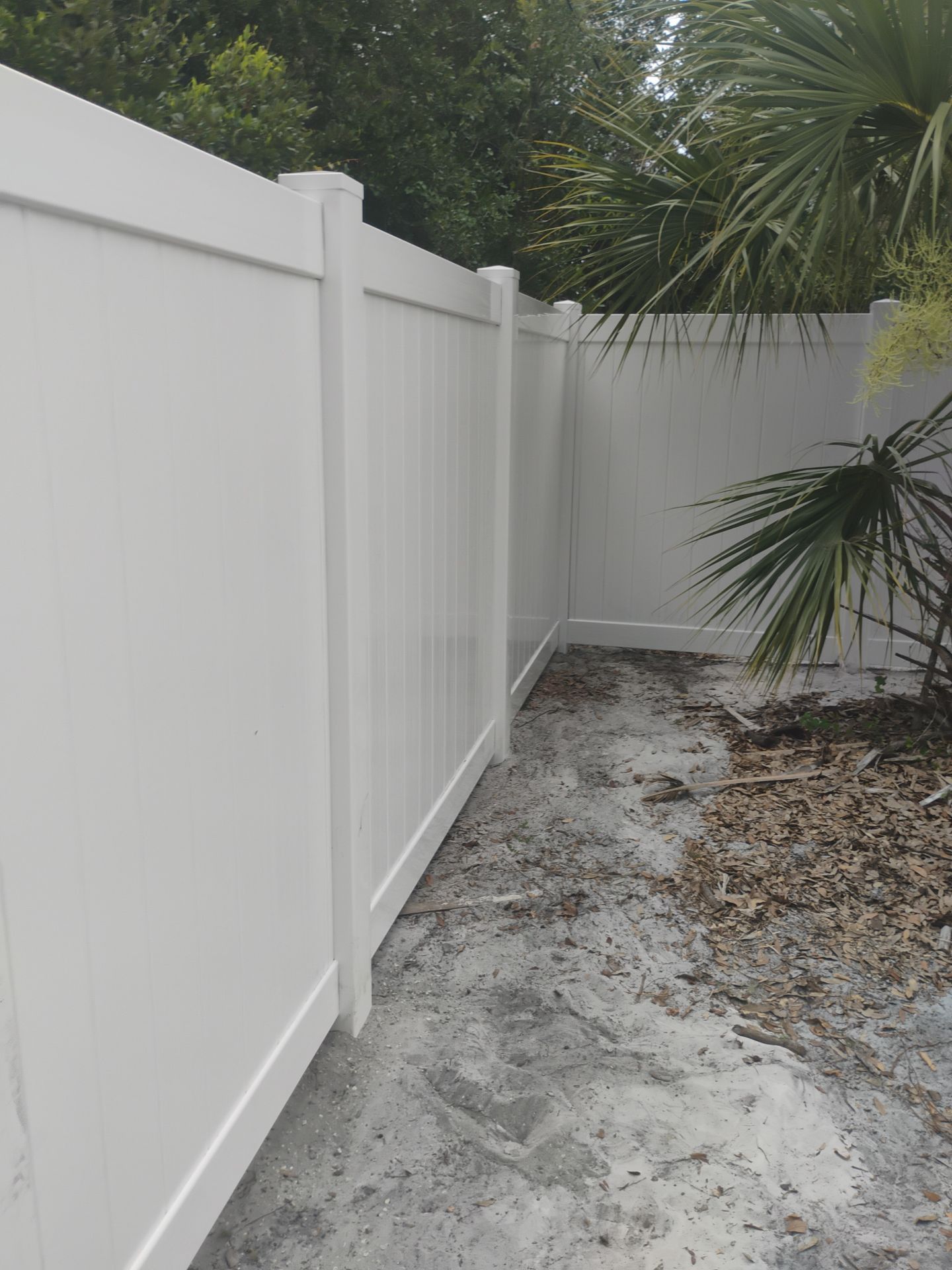 White Vinyl Privacy Fence Installation and Gate Assembly in Punta Gorda by True Fence LLC