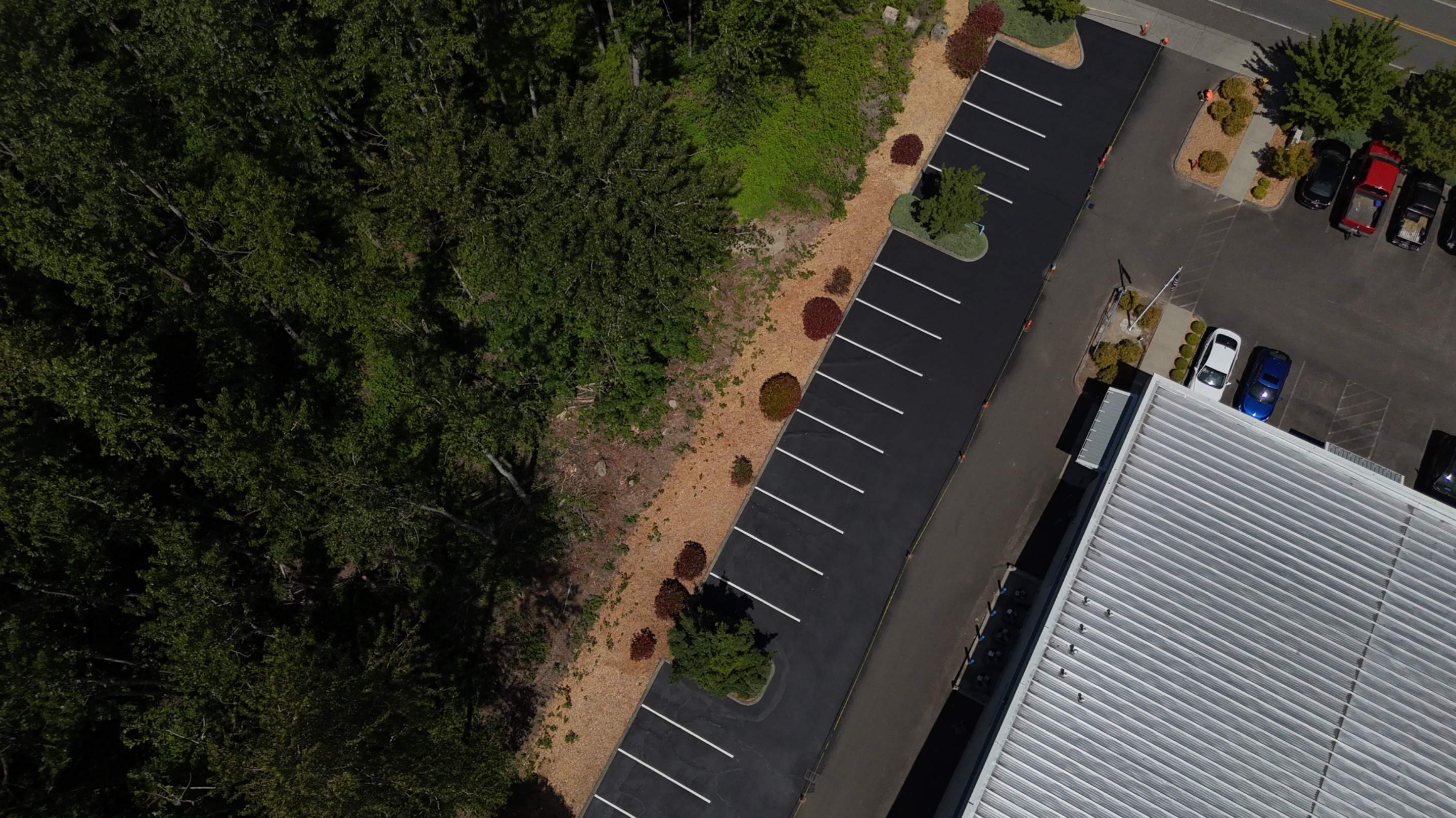 King Machine Business Parking Lot Sealcoat Overlay | Mukilteo by Jireh Asphalt & Concrete Inc 