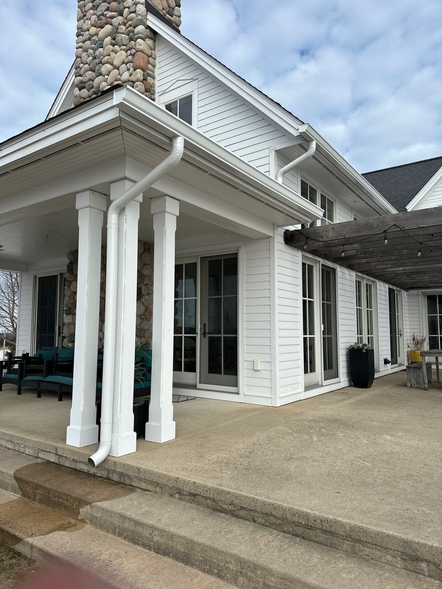 Copper Gutter and Downspout Installation in Suttons Bay by Rainbow Seamless Systems