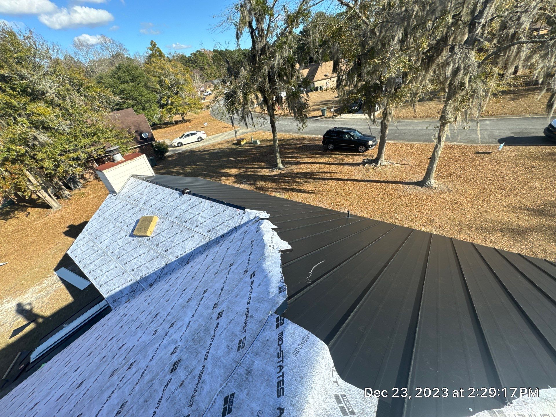 Residential Roofing Installation using Benton 26Ga 1inc Snapcock Metal Roof KYNAR Matte Black by Talya Roofing