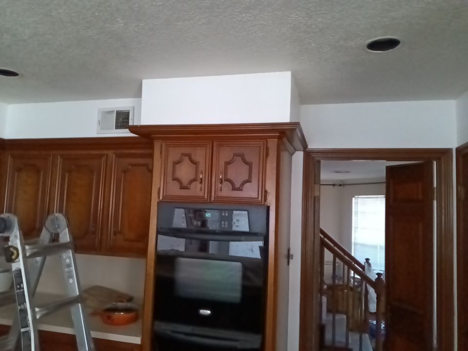 Interior and exterior painting project by Roof Concepts Construction