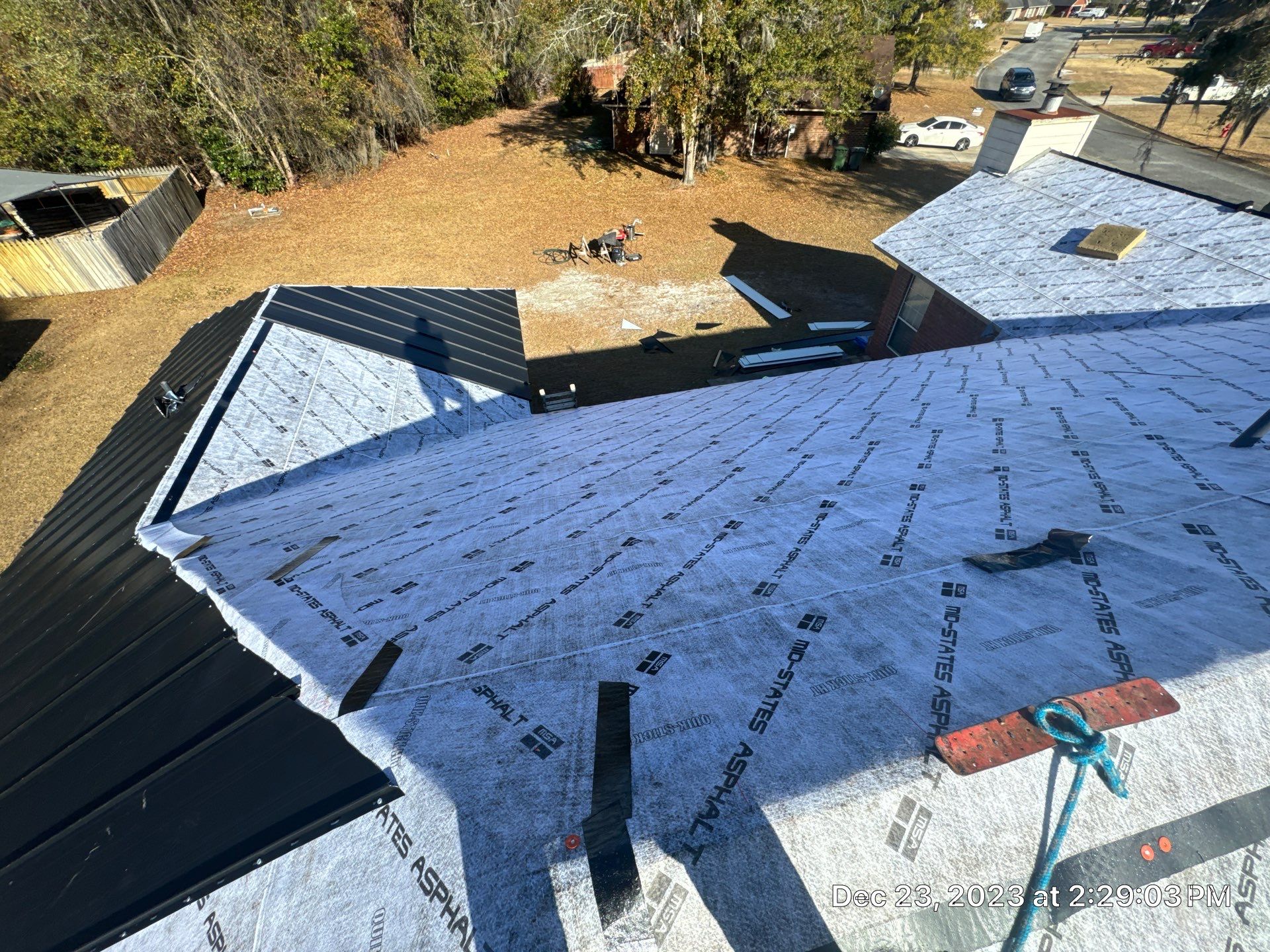 Residential Roofing Installation using Benton 26Ga 1inc Snapcock Metal Roof KYNAR Matte Black by Talya Roofing