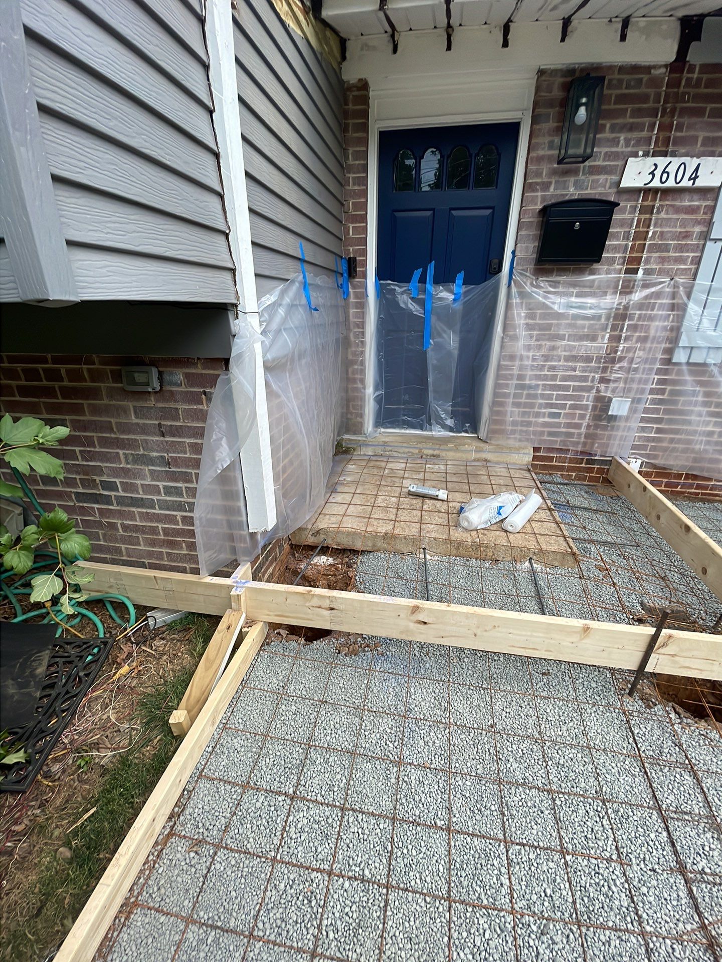 New walkway with stairs and a new front porch by Fairfax Contractors, LLC