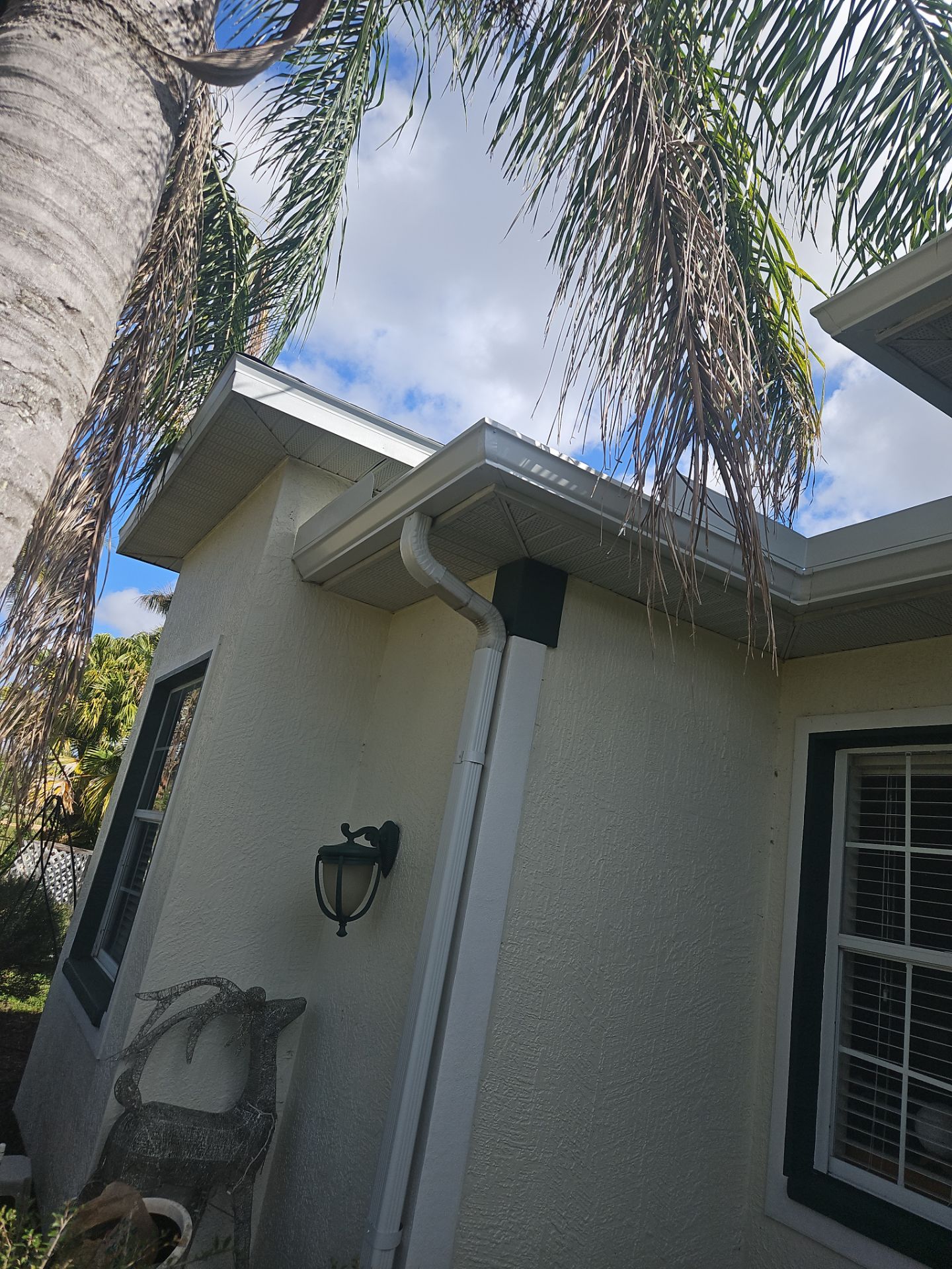White seamless Gutters and downspout repair in Sarasota FL by Gutter Professors