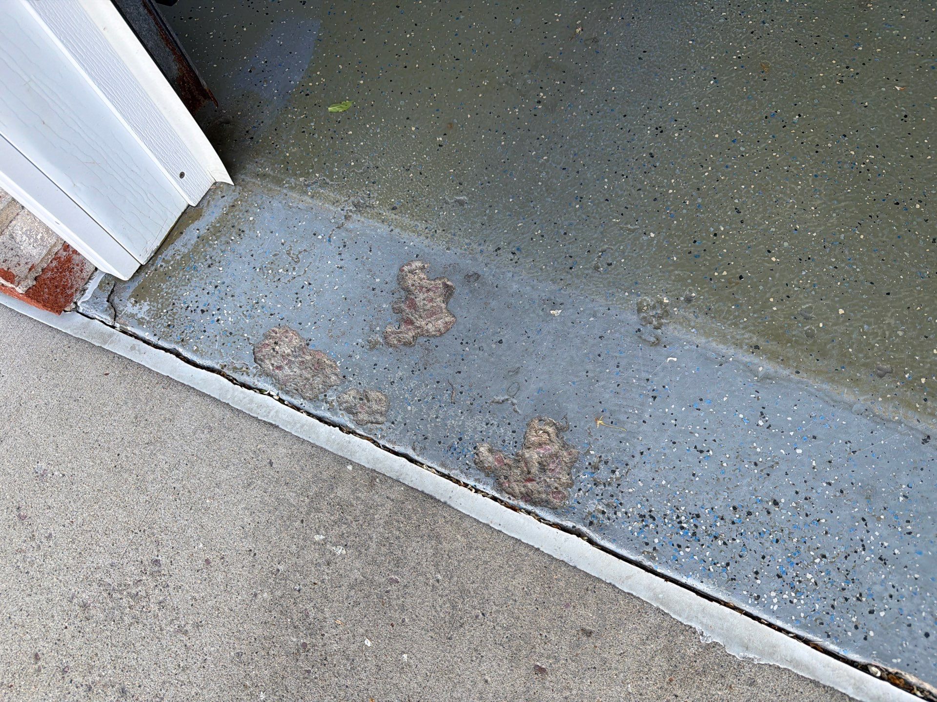 Multi-Car Garage Concrete Coating with Coyote Flake Finish in Sioux Falls by Select Painting, Coatings & Garage Cabinets