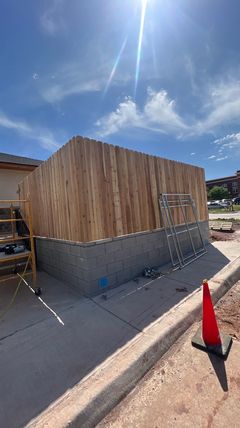 Cedar Fence using Cedar Pickets and Metal Poles by Clays Services Inc