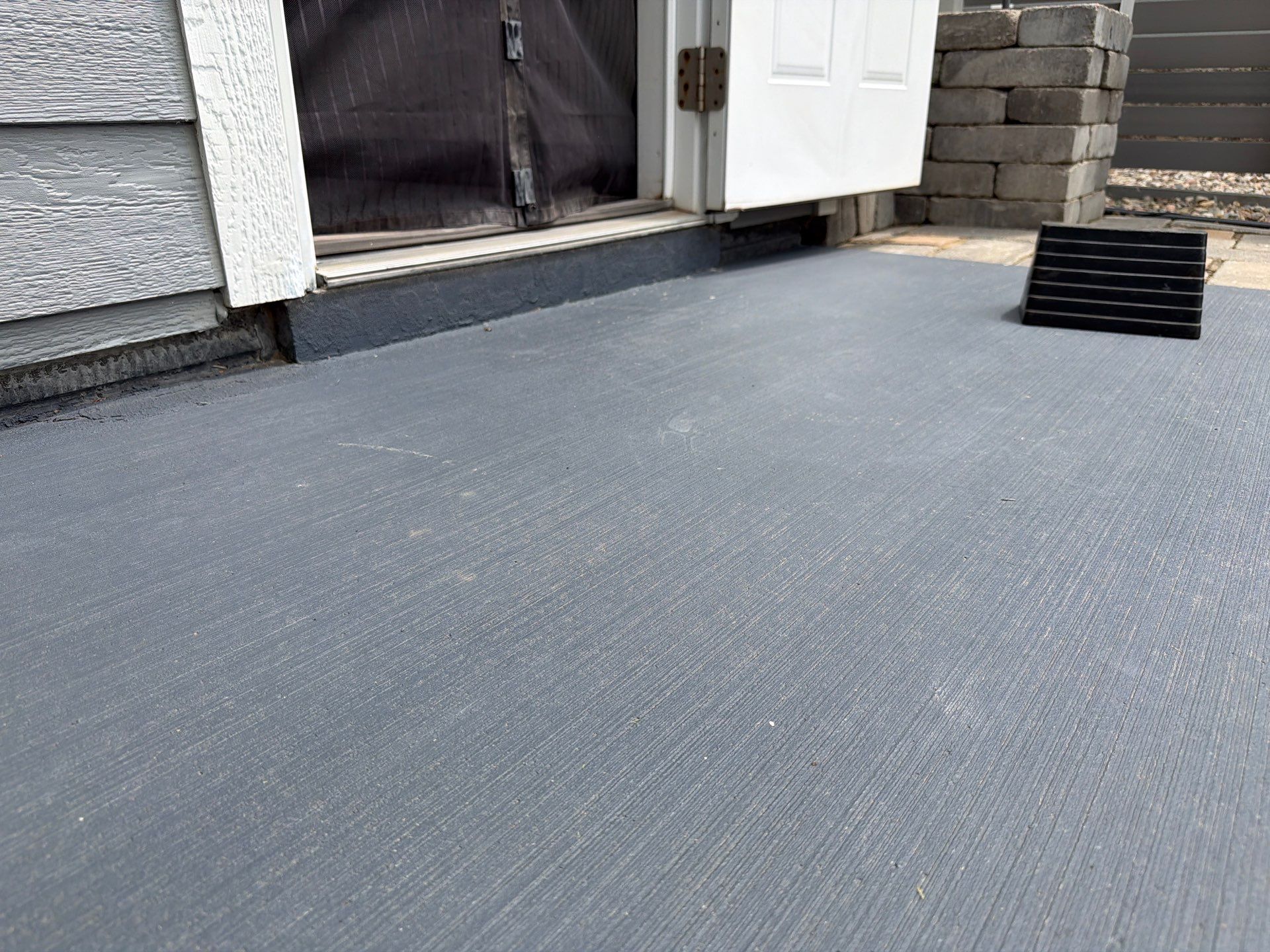 Concrete Patio Coating with Fuzzy Wool Finish in Sioux Falls by Select Painting, Coatings & Garage Cabinets