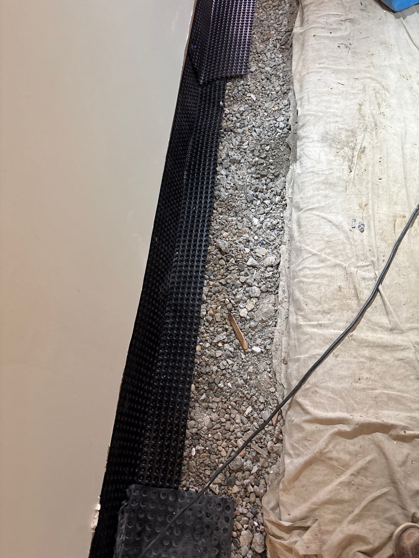 Completing the Connection for Lisa's Drain Tile System by Waterproofing Northeast