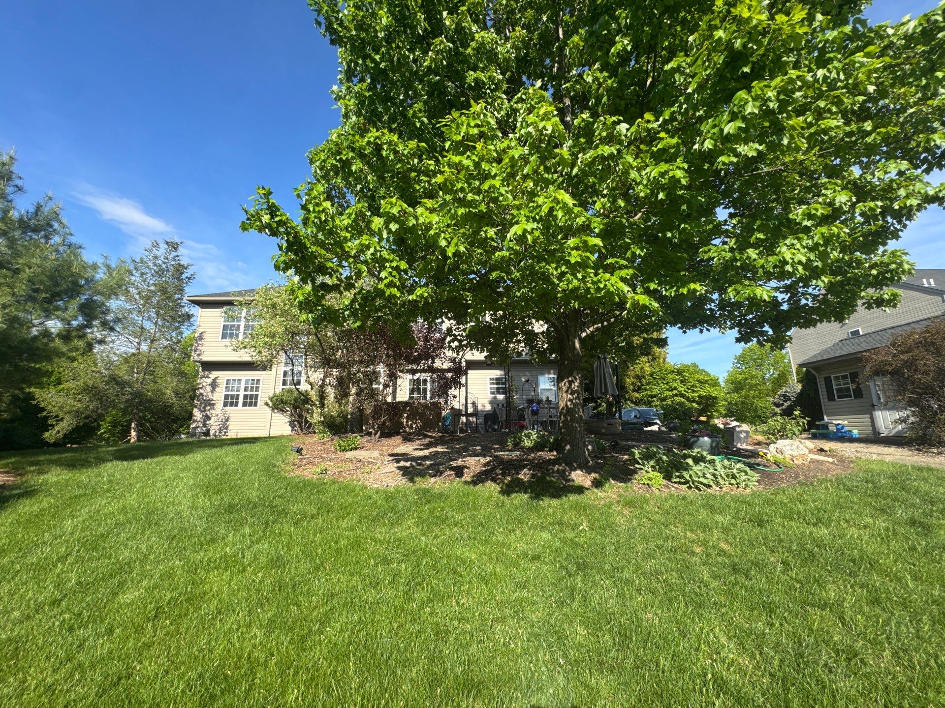 Backyard Retreat: Techo-Bloc Patio + Firepit Lounge by Saylor’s Lawn & Landscape