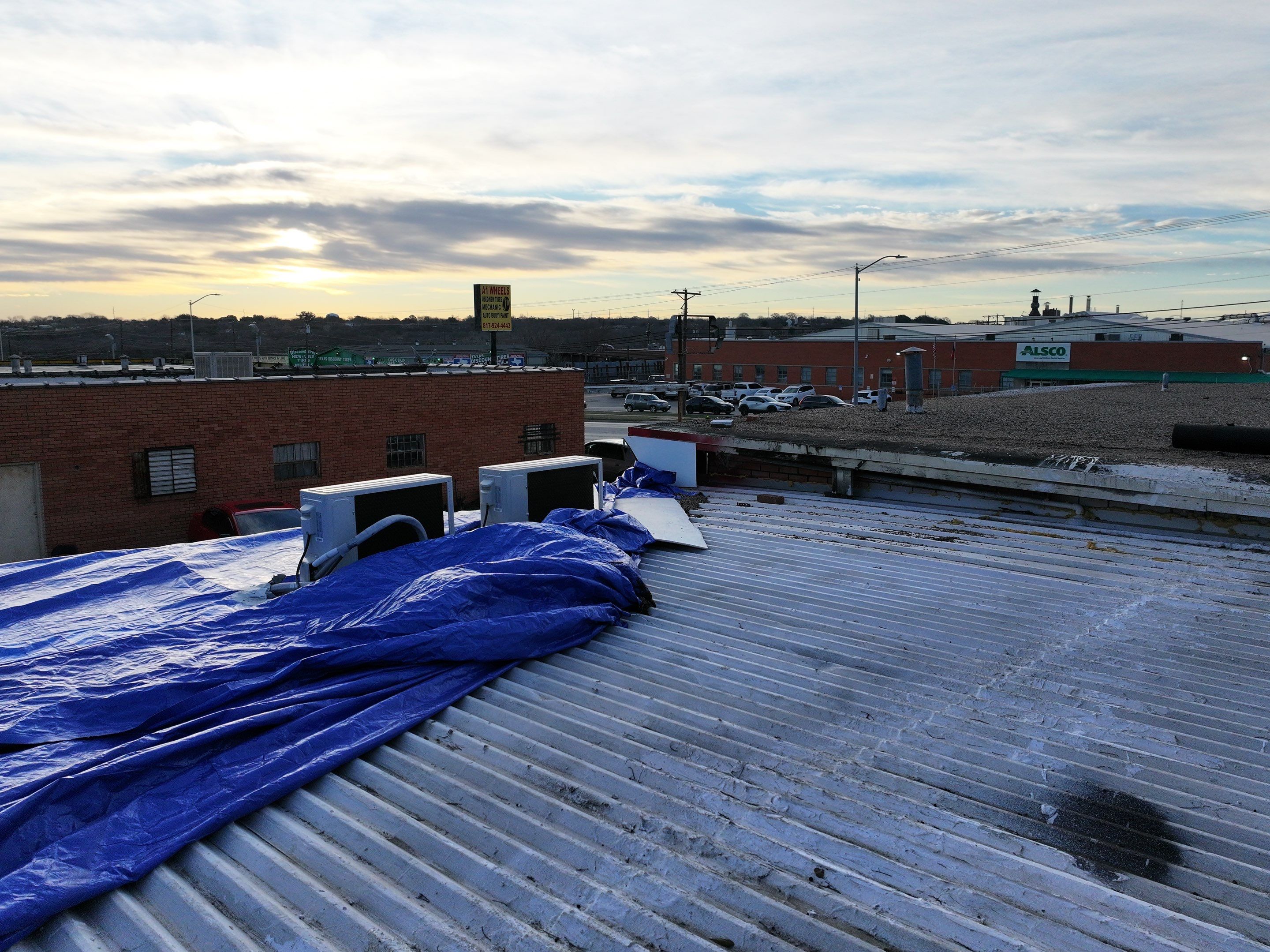 Commercial roofing overlay using GAF TPO over an old ballast roof by Becker Roofing and Exteriors