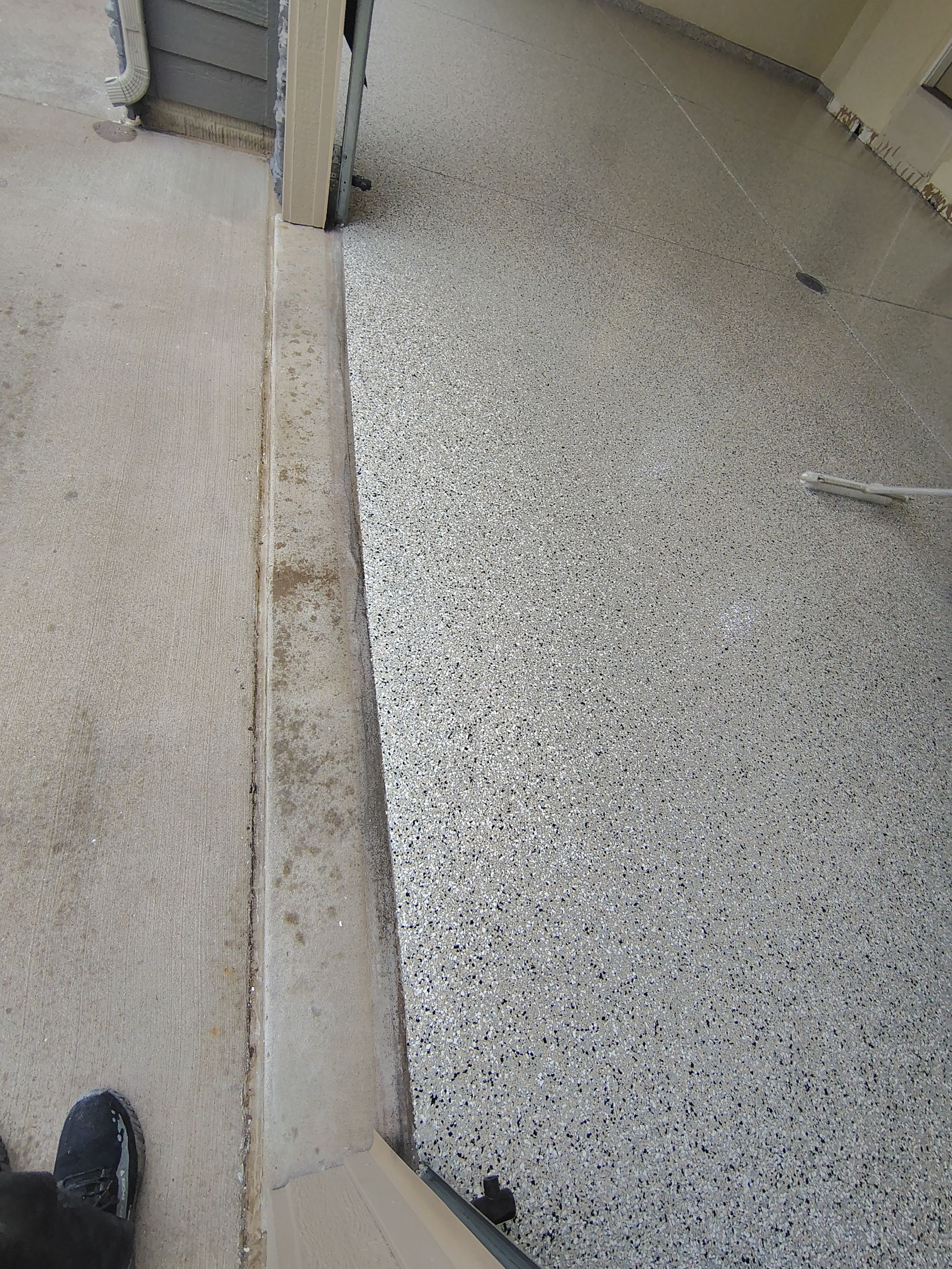 Sioux Falls Garage Floor Repair and Speckled Epoxy Coating Installation by Select Painting, Coatings & Garage Cabinets