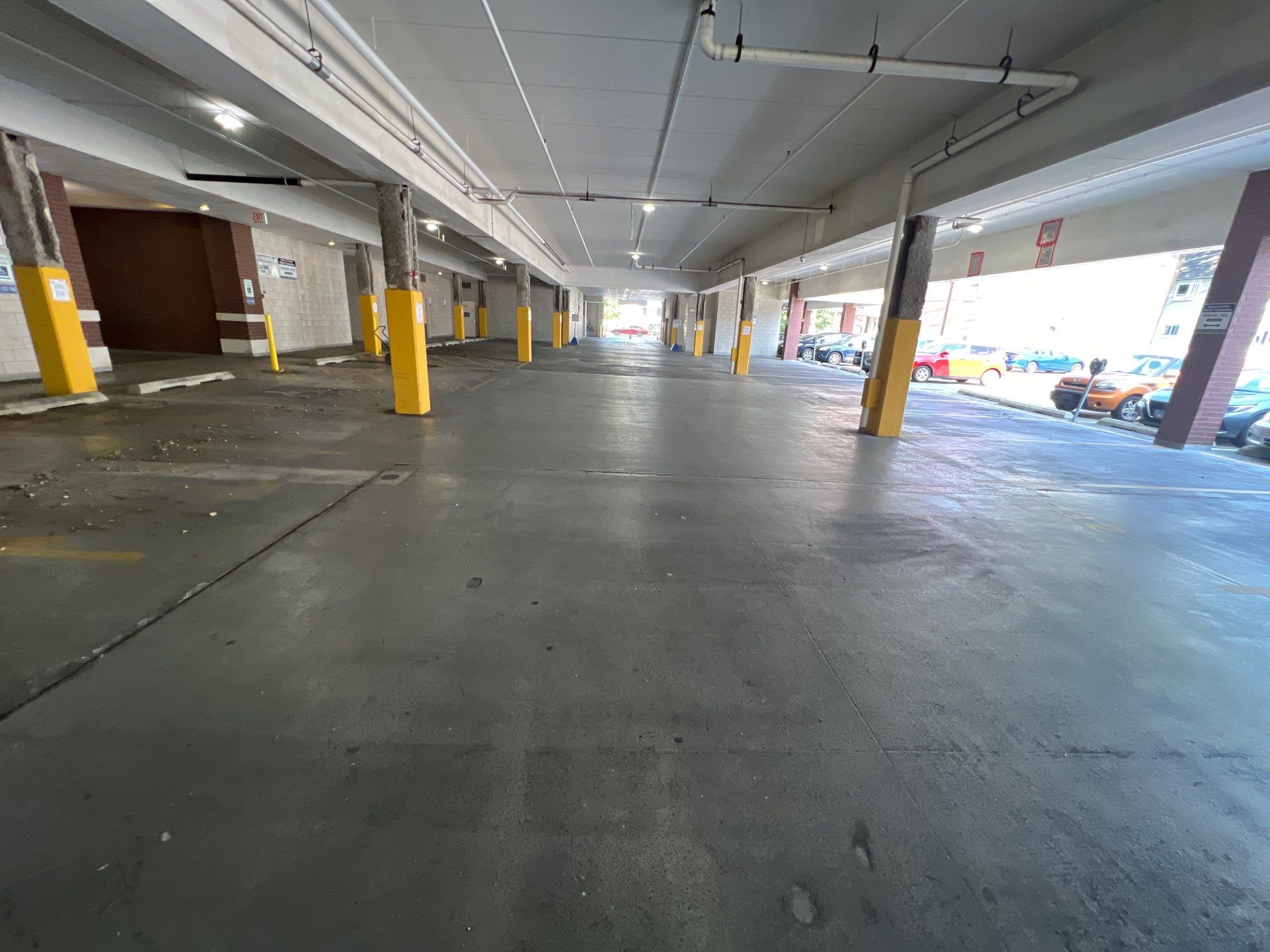 Parking garage using Hot water by Northern Power Washing LLC.