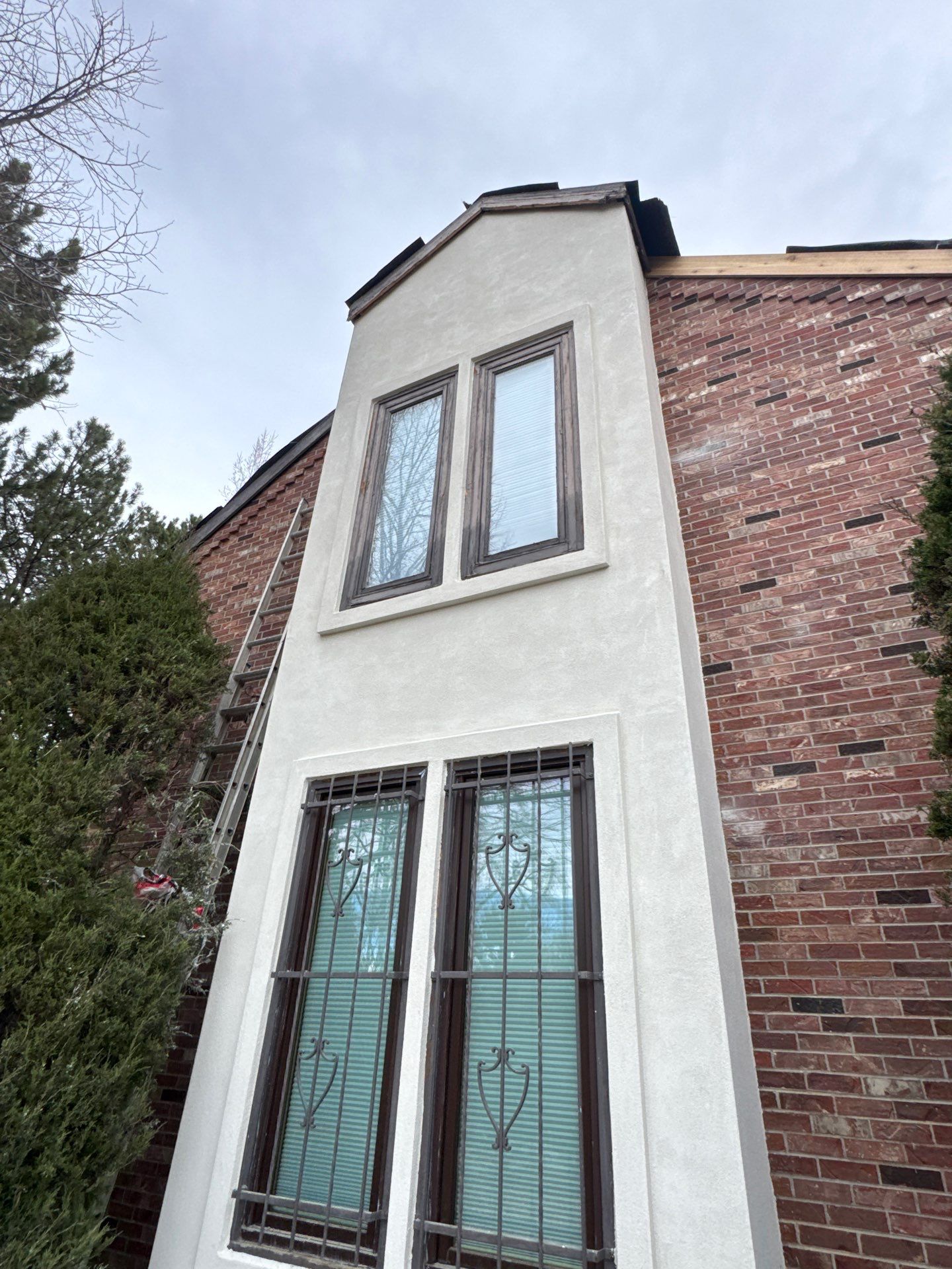 Unified Stone Coated Roof & Stucco Remodle by Blue Peaks Roofing LLC