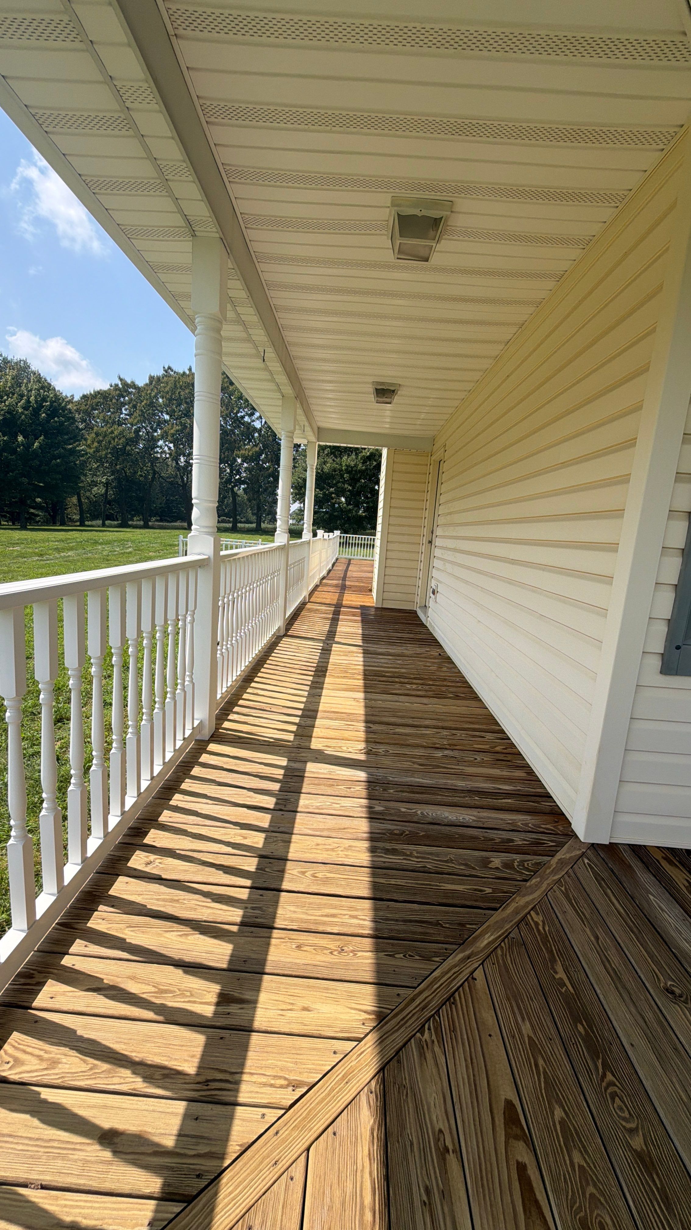 Vinyl Siding House Washing and Wood Deck Restoration in Carroll County by Baltimore Pressure Washers Inc.
