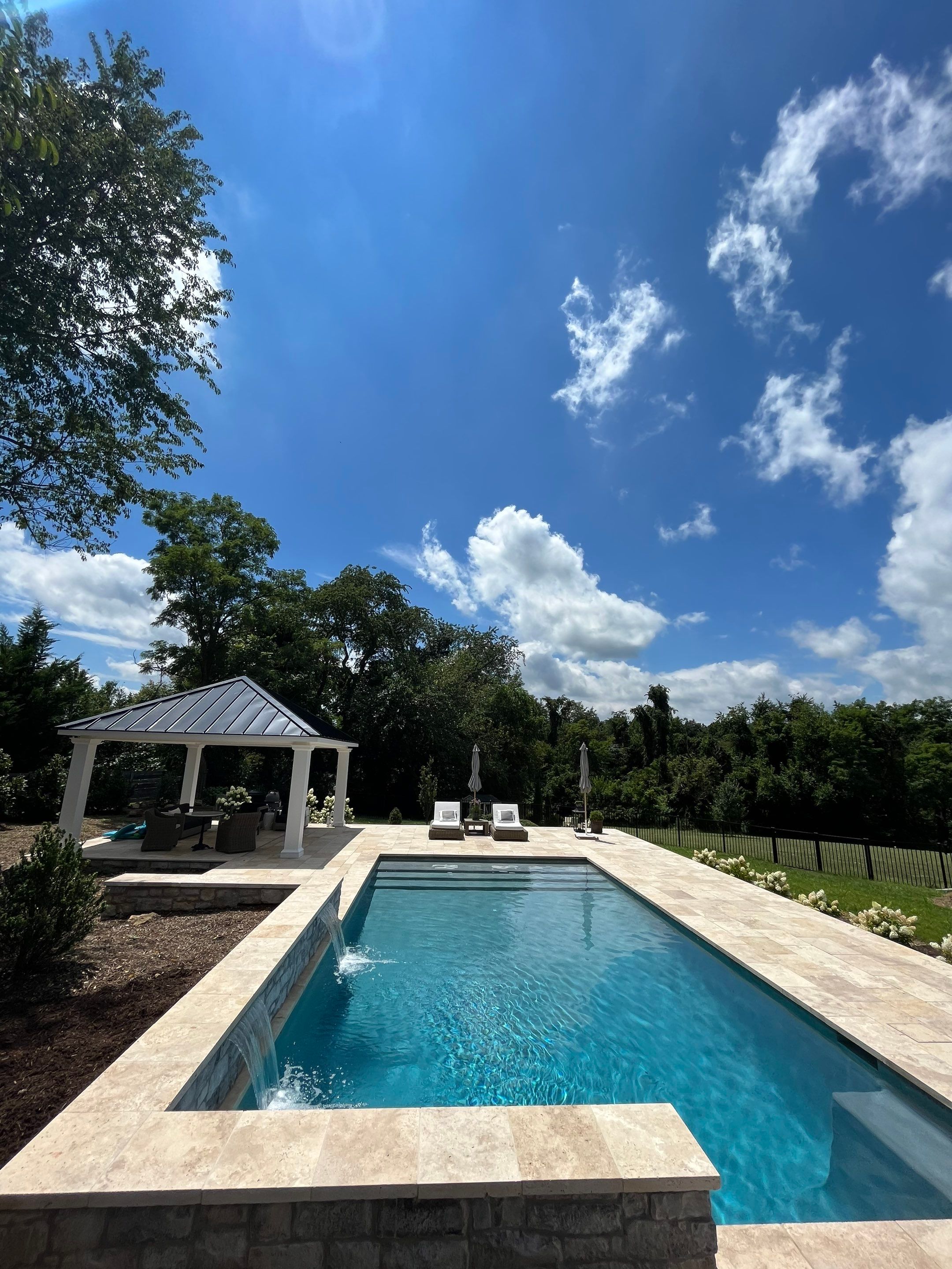 Gunite Pool w/ Raised Wall and Waterfalls by Elysium Pools