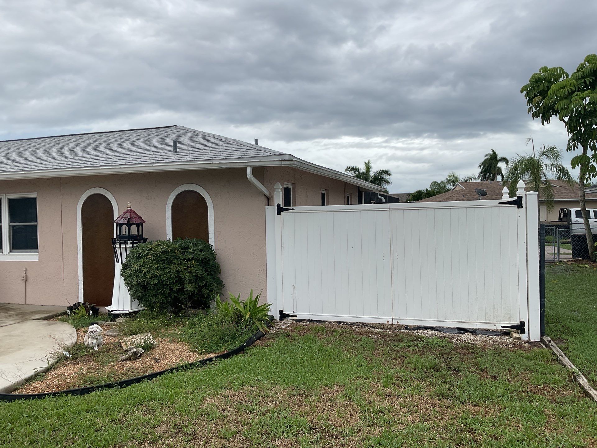 White Seamless Gutters and Splash Guards in Fort Myers FL by Gutter Professor by Gutter Professors
