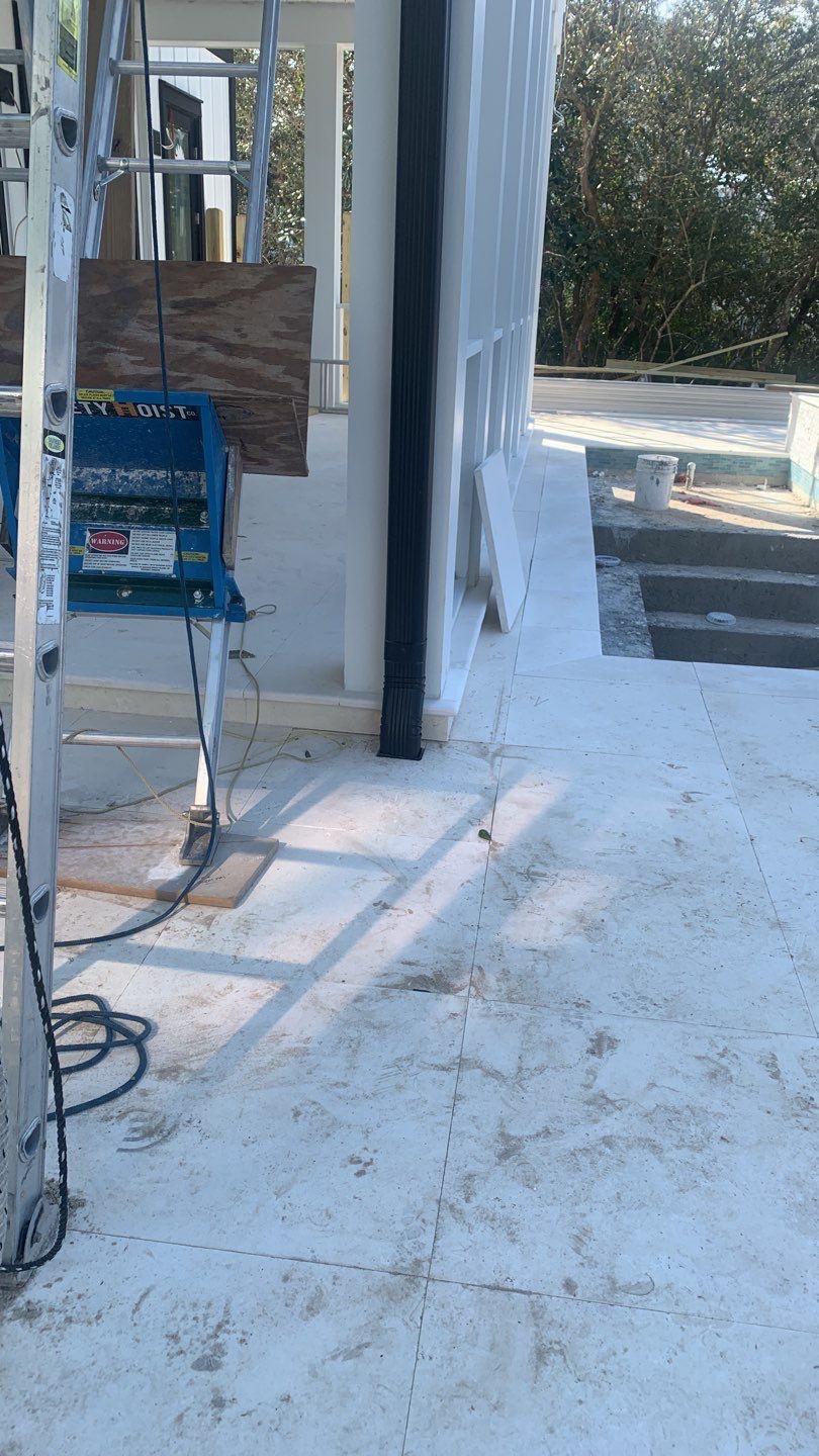 Seamless Gutter Installation Using Black Half Round Seamless Gutters by Gutter Professors