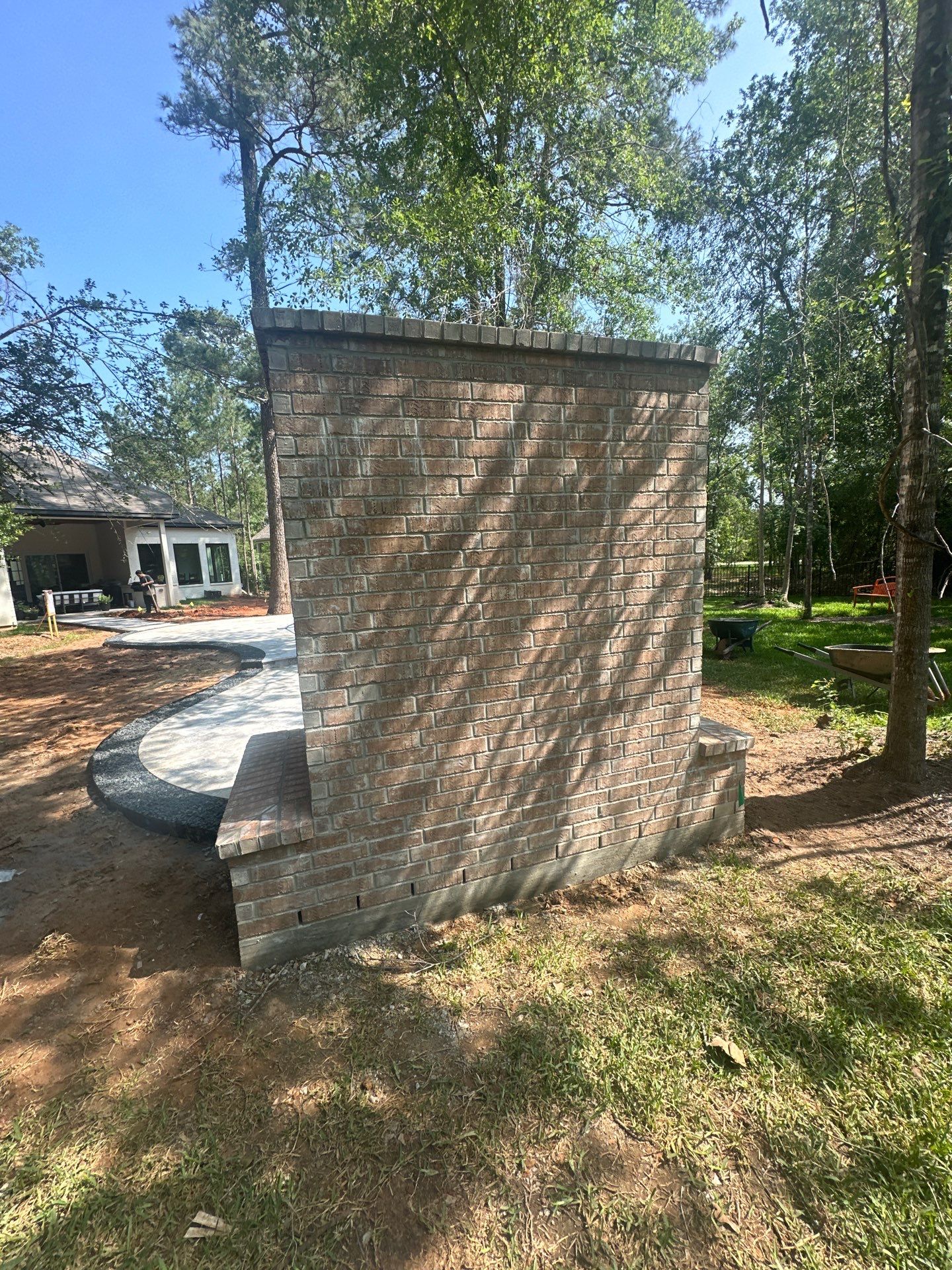 Outdoor Fireplace in Tomball, TX by SophAlx LLC
