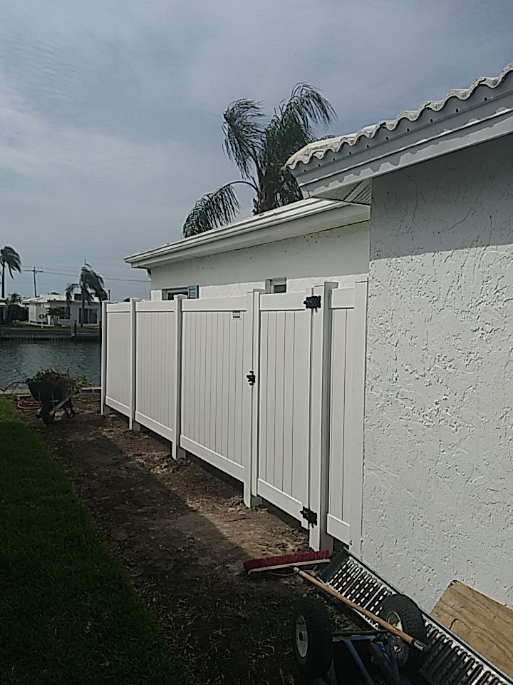 Vinyl privacy fence installation used as a shower enclosure.  by Asap fence and gates, LLC