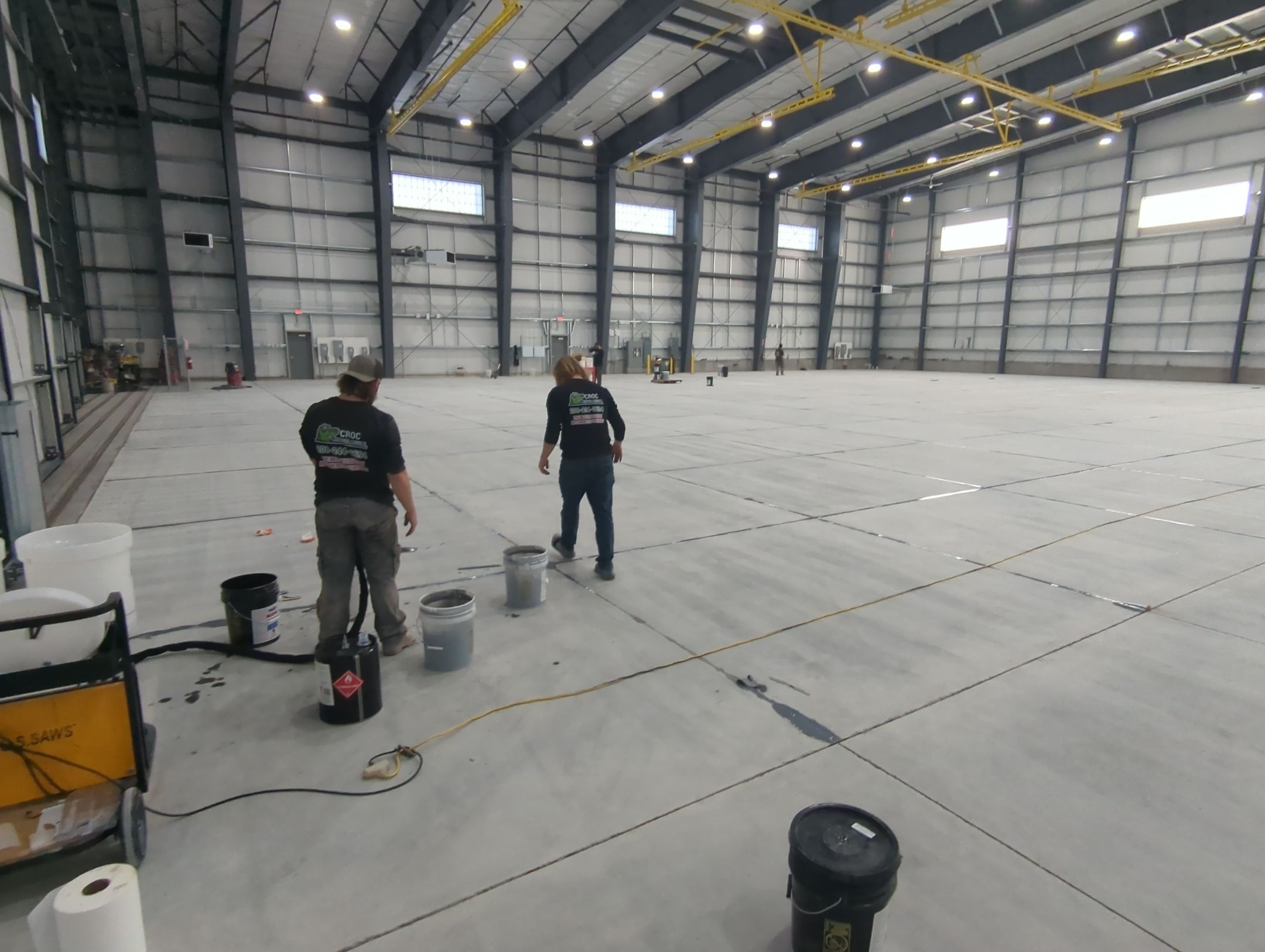Airplane Hanger using Light Grey Commercial Penntek Epoxy by Croc Coatings, LLC