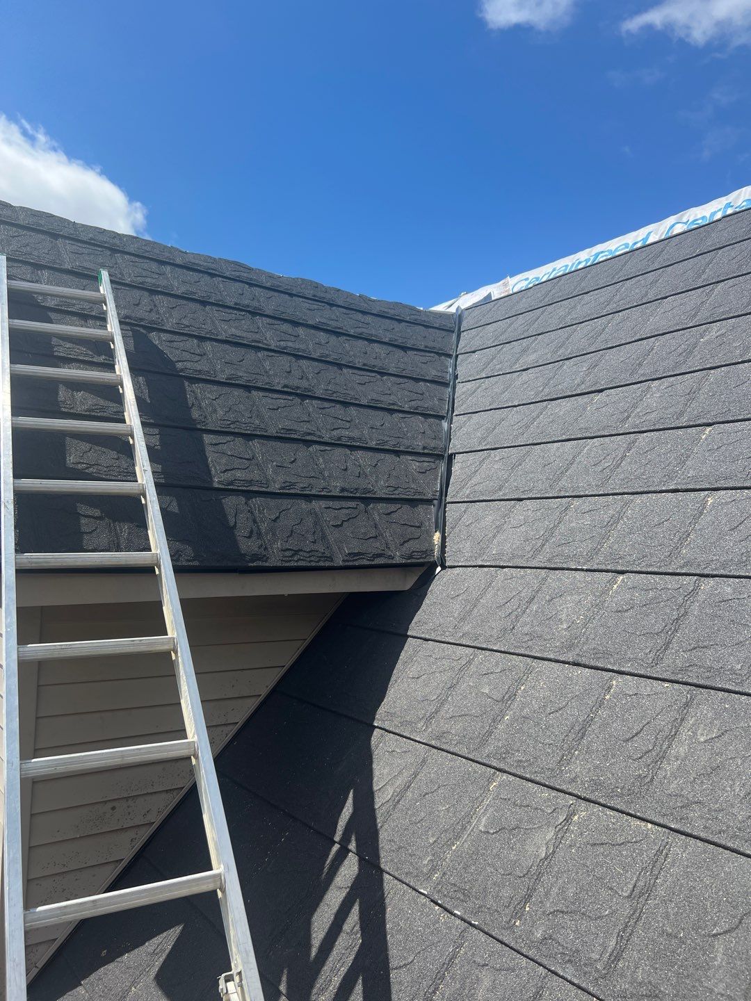 Residential Roofing Repair using Metstar Stone Coated Charcoal by Nitro Roofing and Construction
