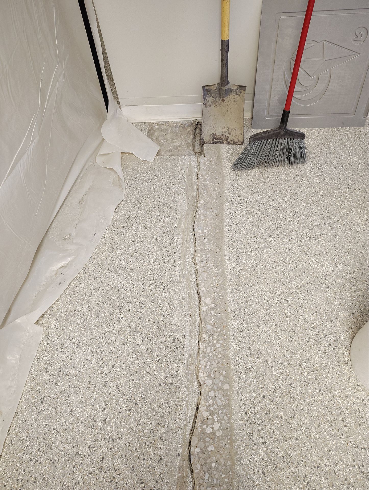 Medina Cracked basement floor with Epoxy by Beck Restoration Management Group