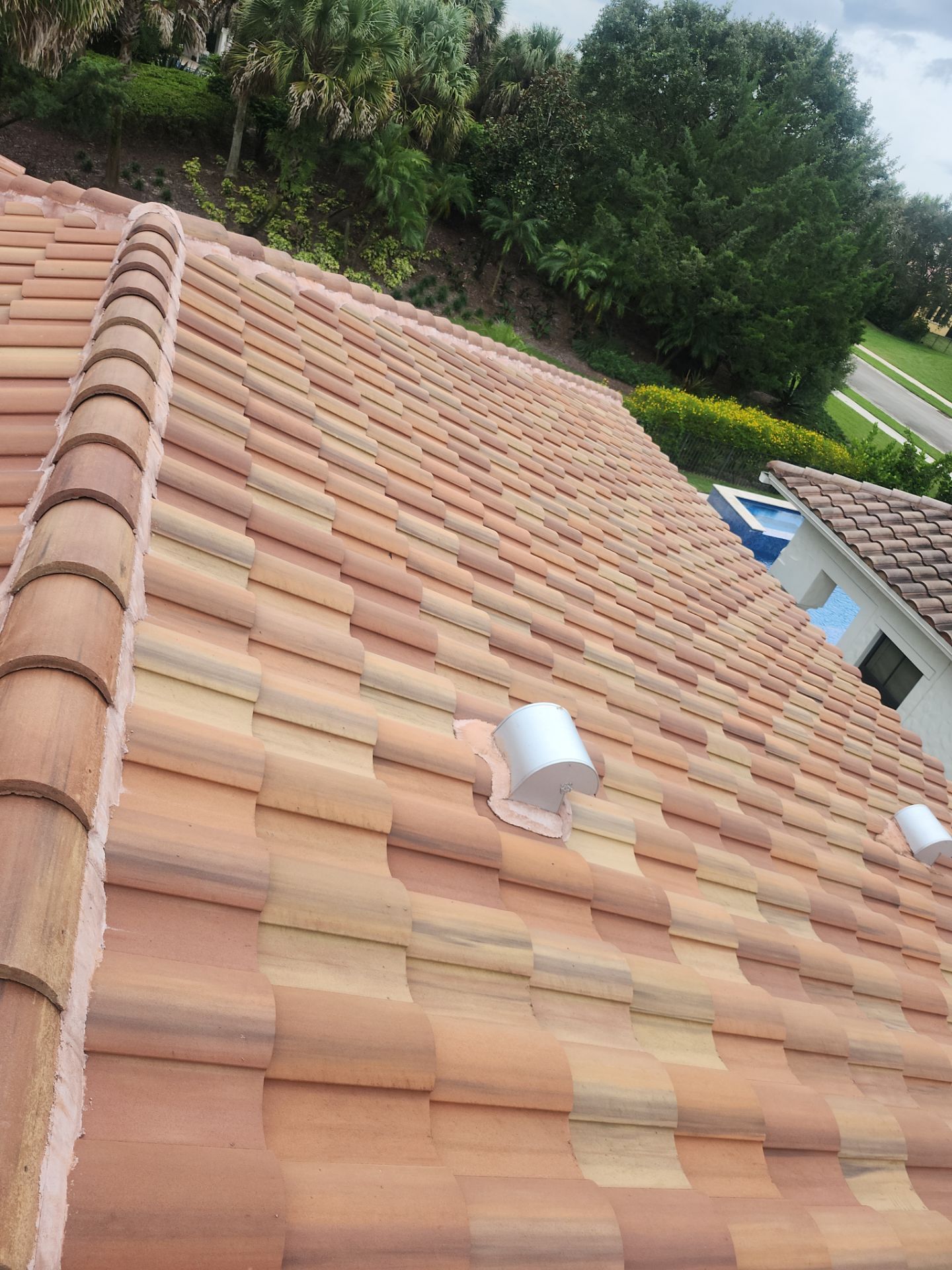 Tile Roof and Roof-to-Wall Repairs in Parkland by Aastro Roofing