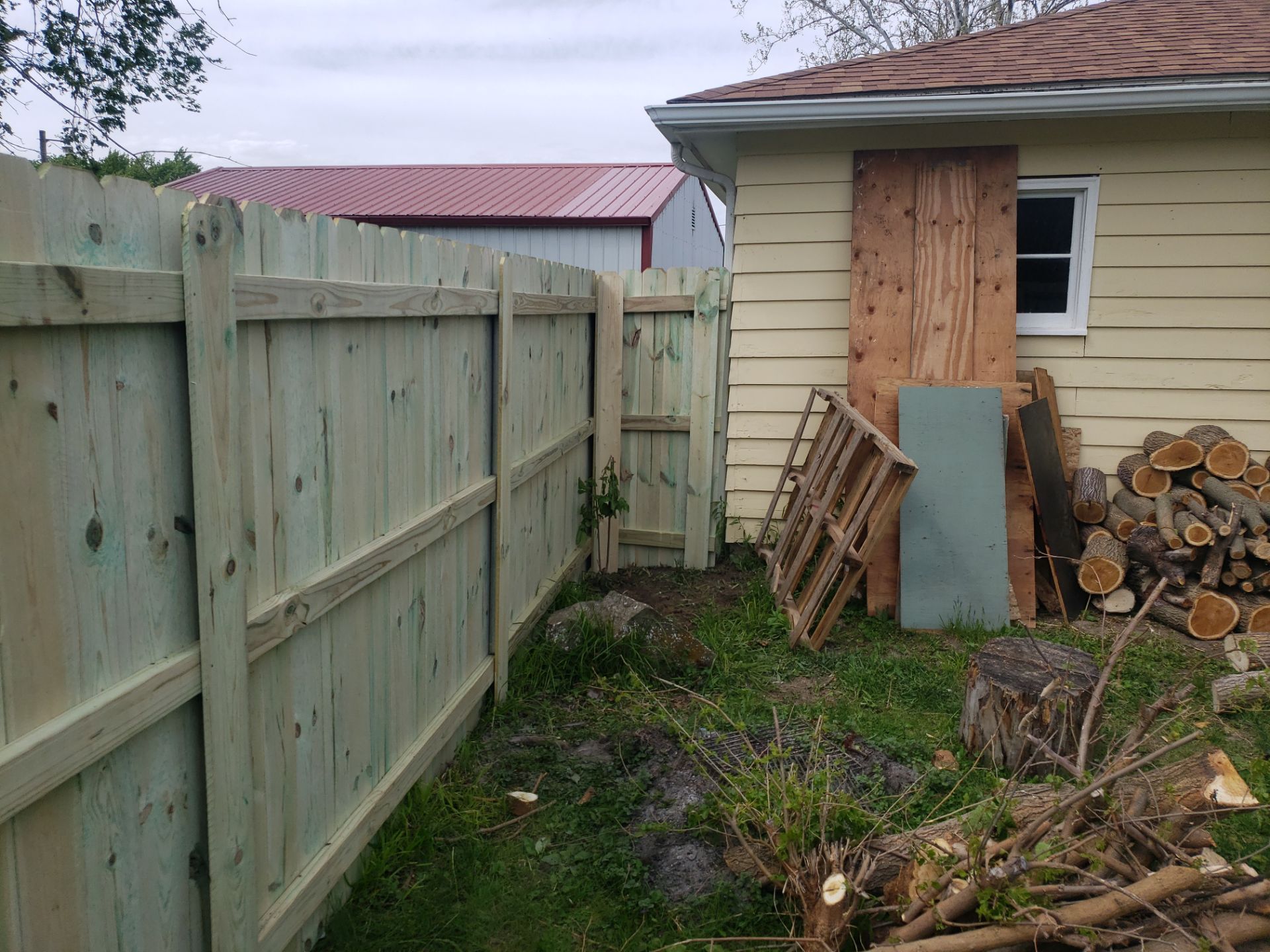 Pressure-Treated Wood Privacy Fence Installation in Waterloo by Perfect Picket Fence and Stain